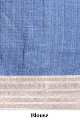 Blue geometric design dola silk saree with contrast zari border and matching blouse