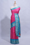 Pink dola silk saree with fine zari stripes contrastzari border and a rich peacock floral woven pallu along with printed contrast blouse