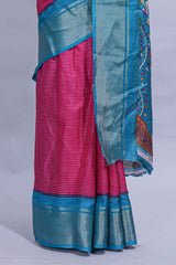Pink dola silk saree with fine zari stripes contrastzari border and a rich peacock floral woven pallu along with printed contrast blouse