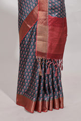 Steal blue dola silk saree with contrast coper gold zari border and contrast blouse