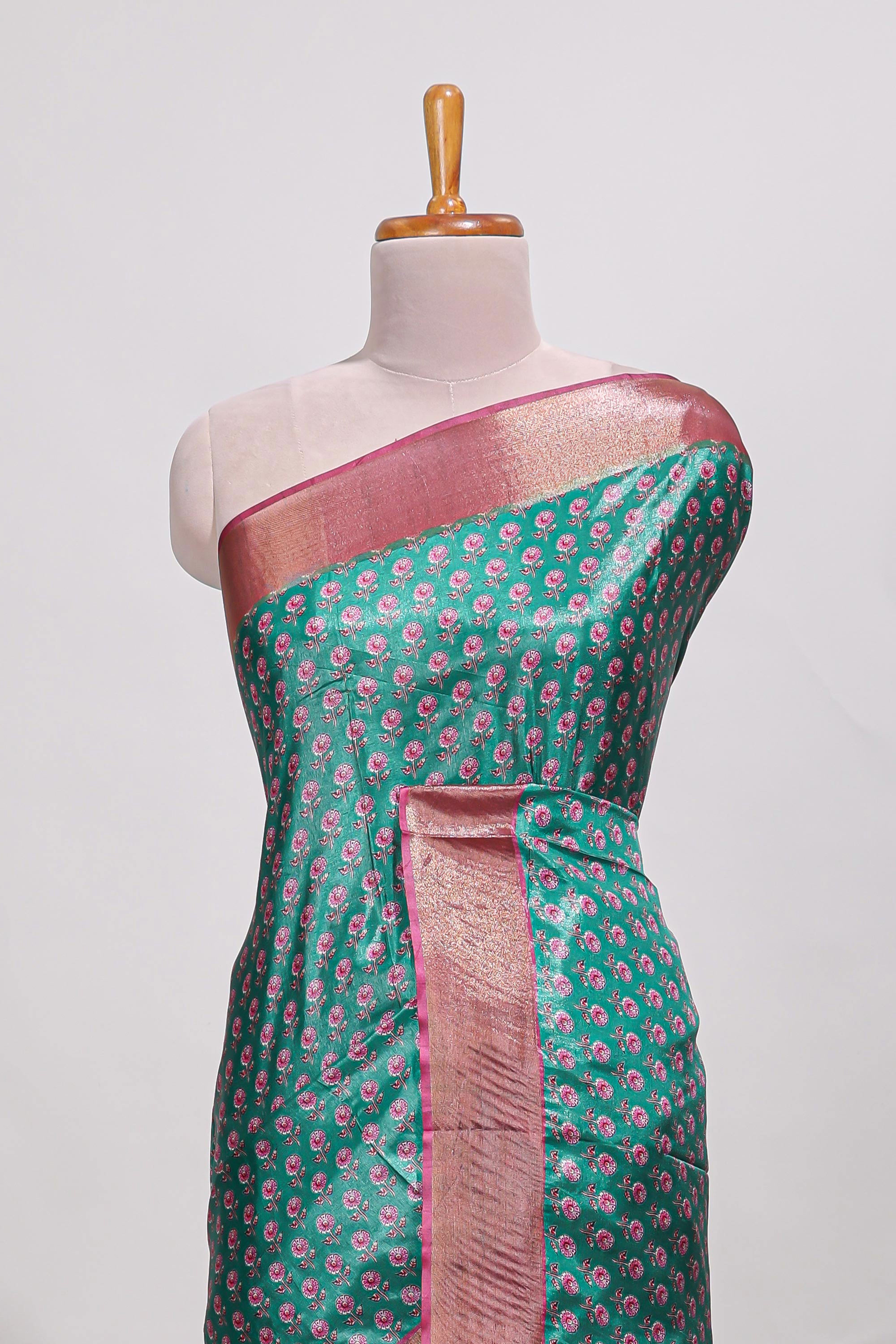 Bottle green dola silk saree with contrast coper gold zari border and contrast blouse