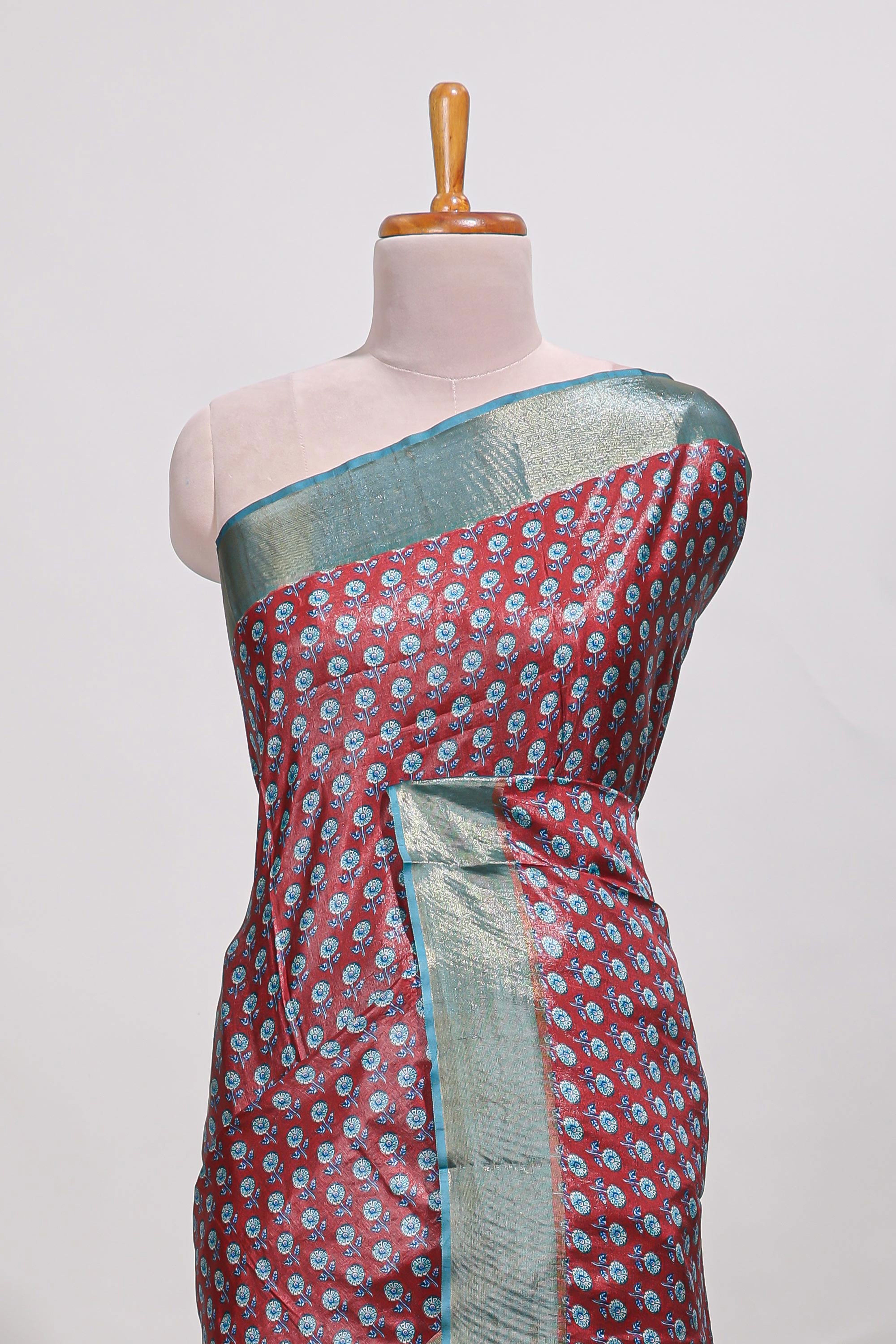 Maroon dola silk saree with contrast coper gold zari border and contrast blouse