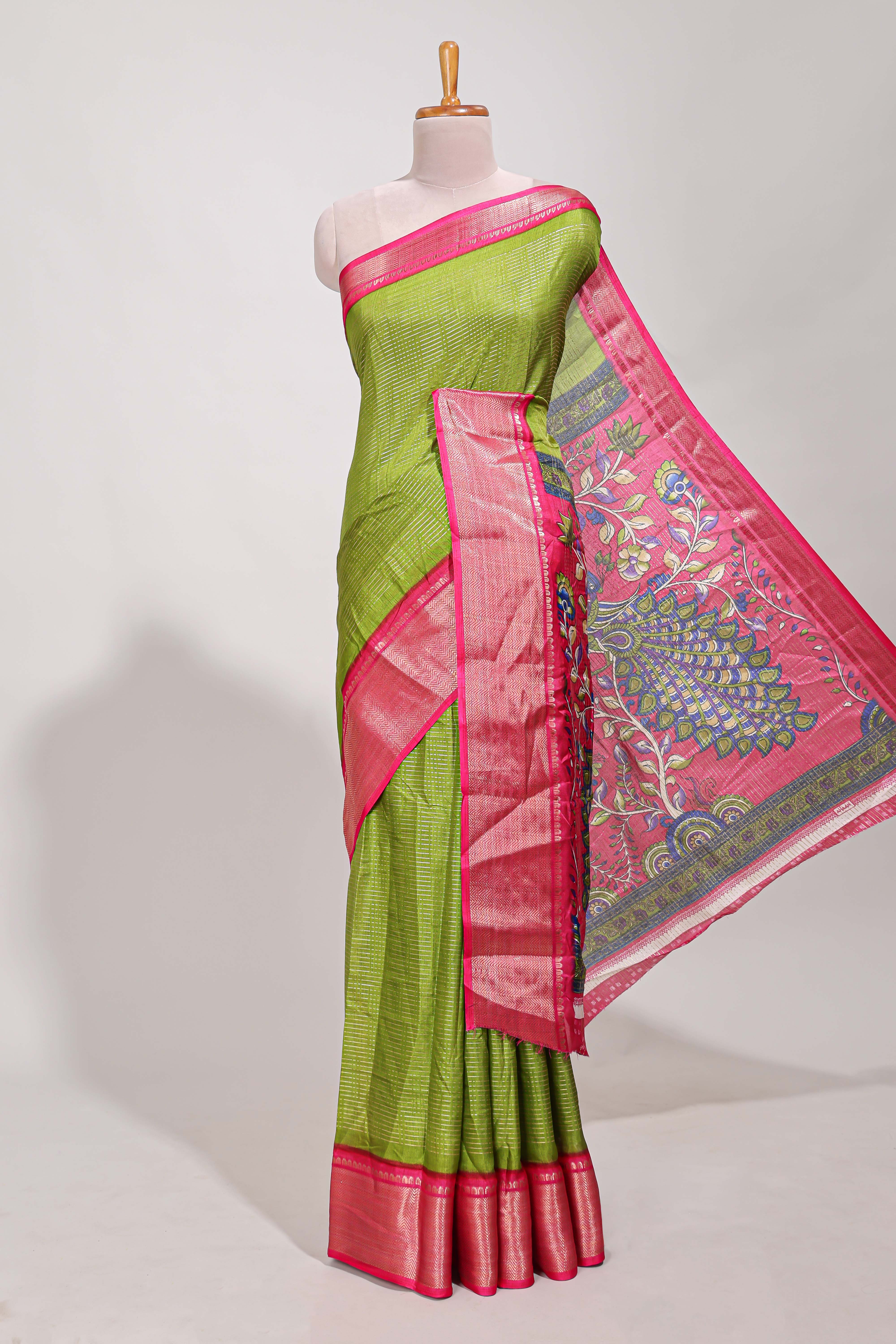 Green Dola silk saree all overzari workdesign with contrast zig zag border and contrast kalmkari printed pallu