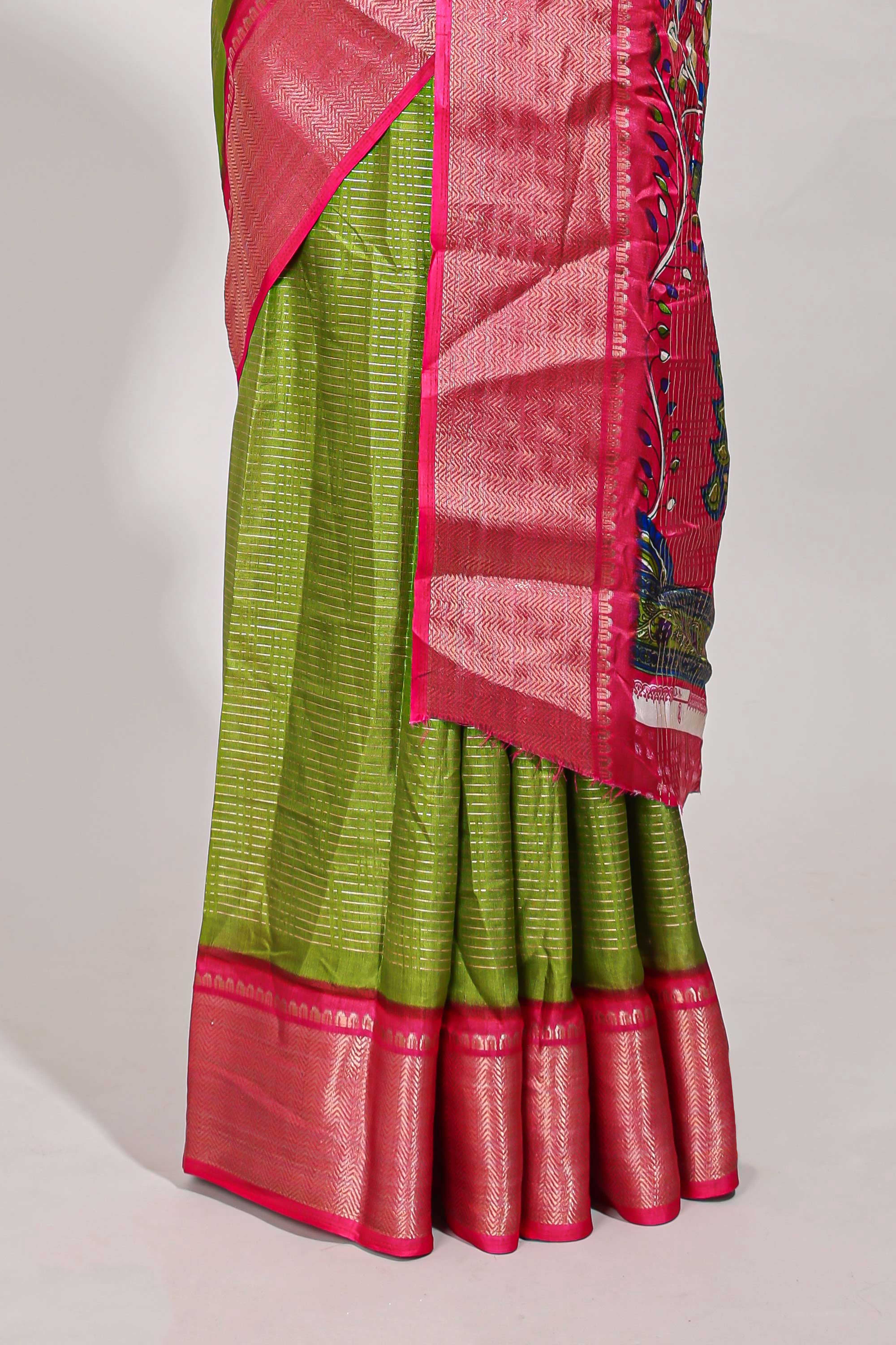 Green Dola silk saree all overzari workdesign with contrast zig zag border and contrast kalmkari printed pallu