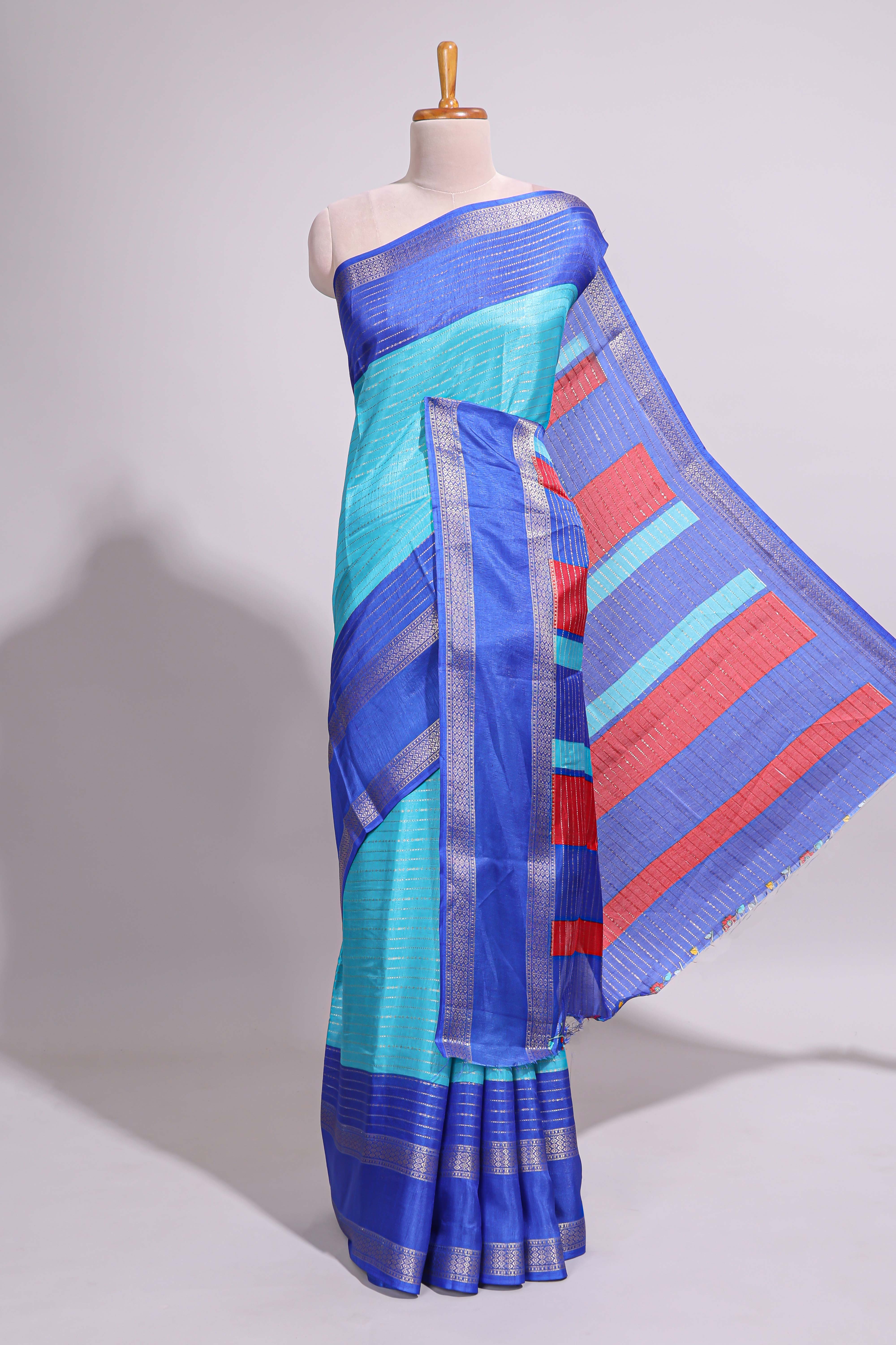 Turquoise green zari striped dola silk saree with contrast border and floral printed blouse