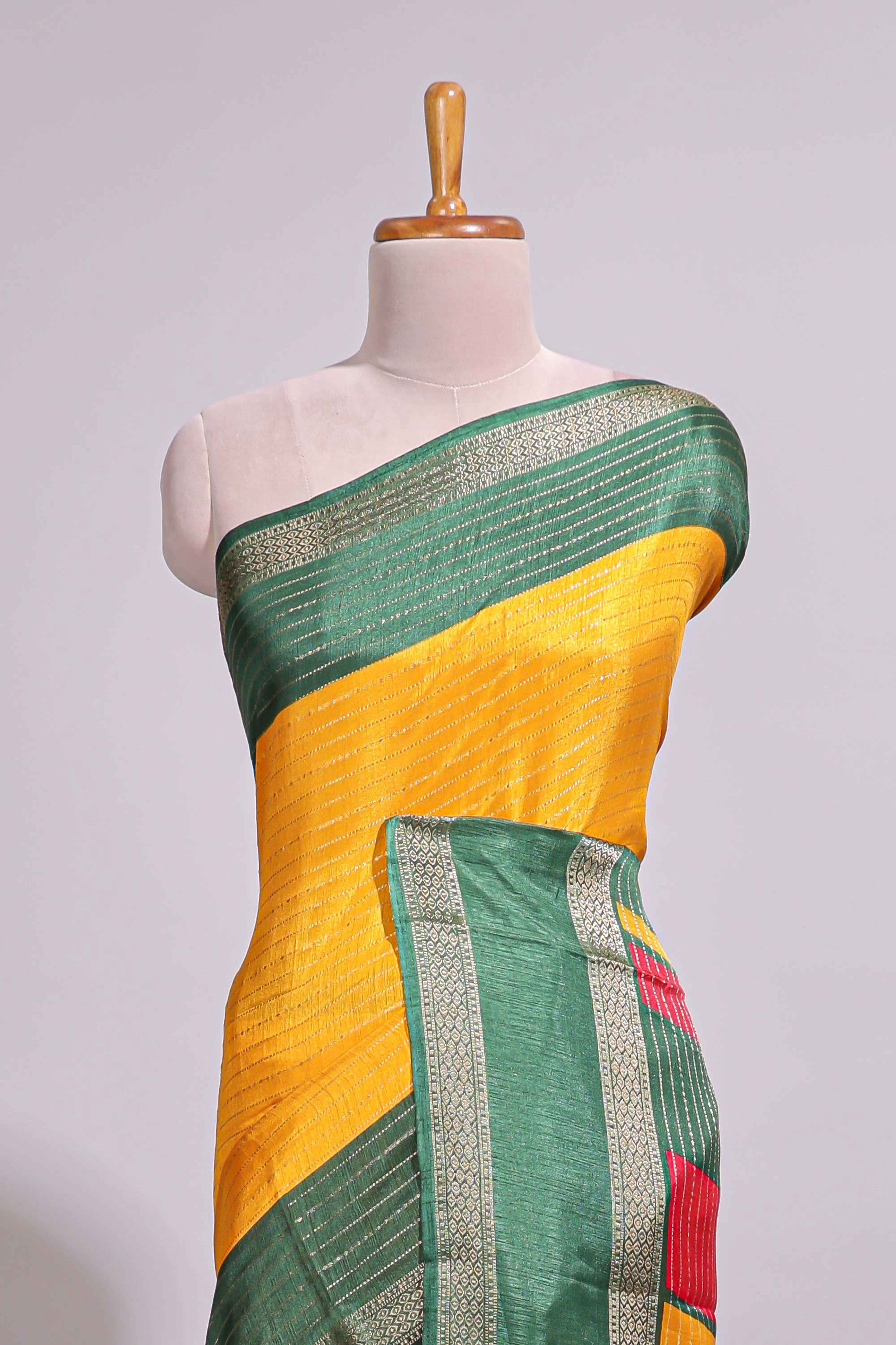 Yellow zari striped dola silk saree with contrast border and floral printed blouse