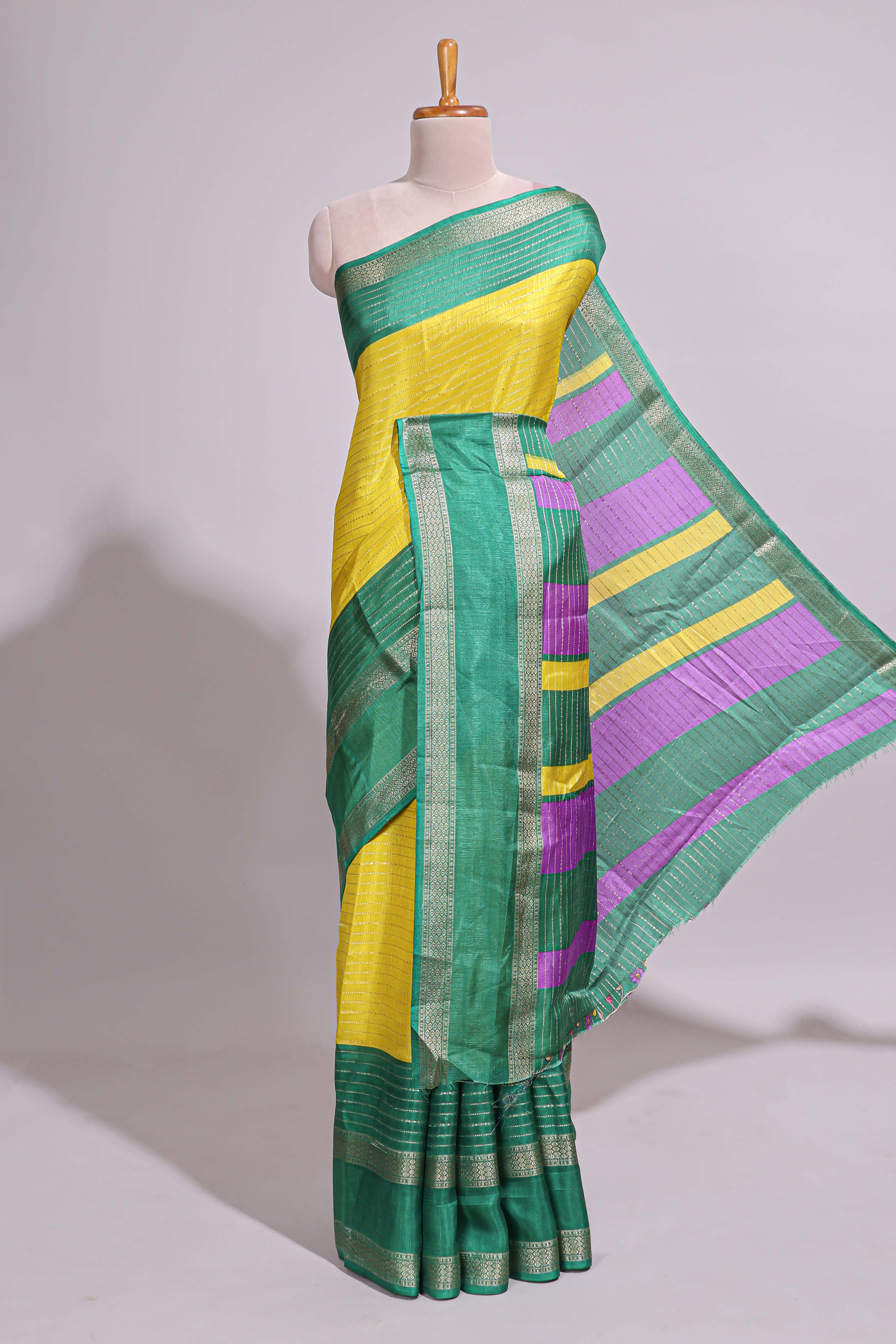 Lime yellow zari striped dola silk saree with contrast border and floral printed blouse