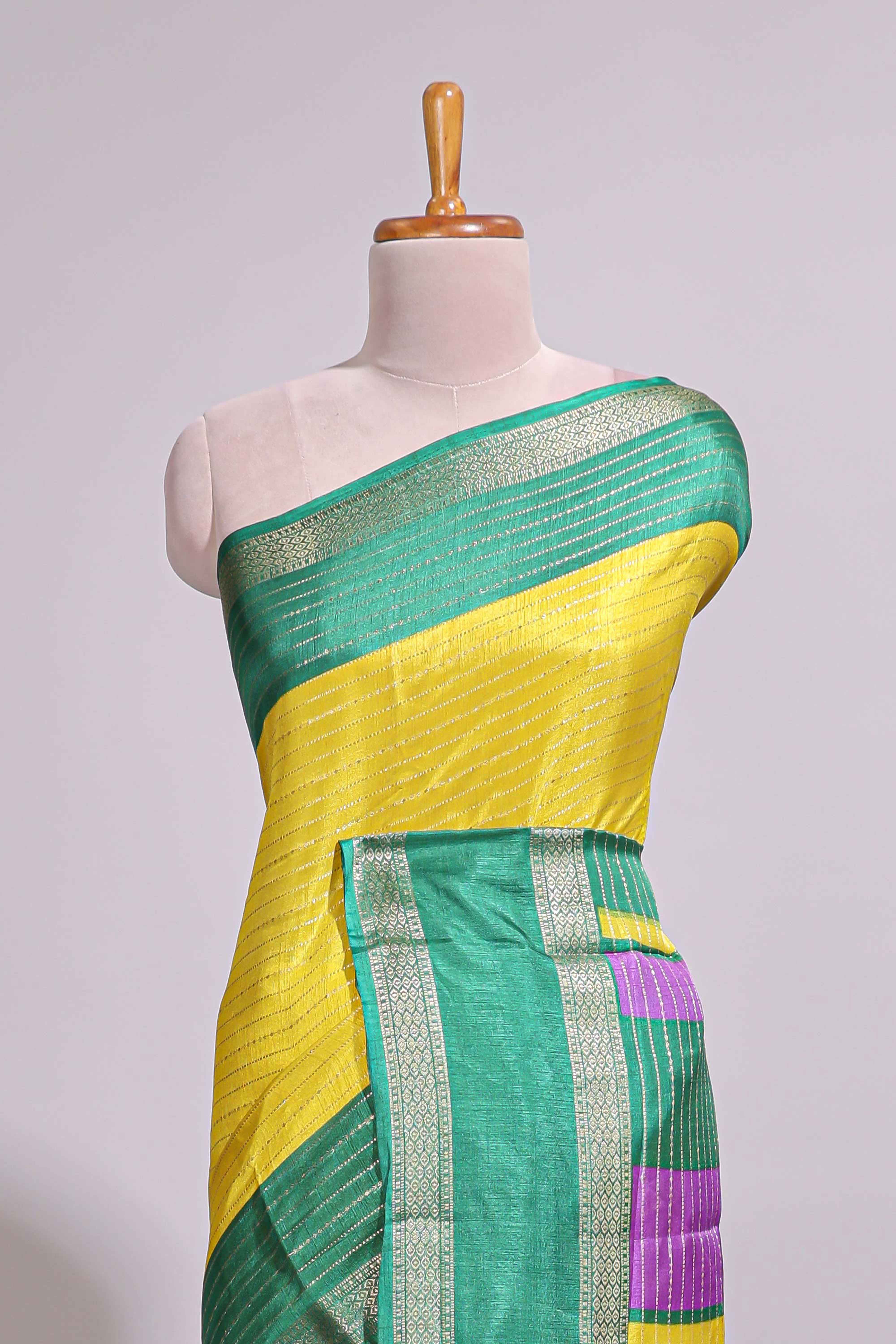 Lime yellow zari striped dola silk saree with contrast border and floral printed blouse