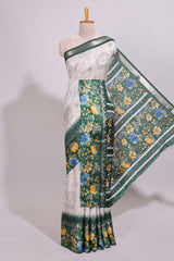 Off white floral design dola silk saree with contrast green border and printed motifs blouse