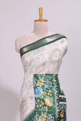 Off white floral design dola silk saree with contrast green border and printed motifs blouse