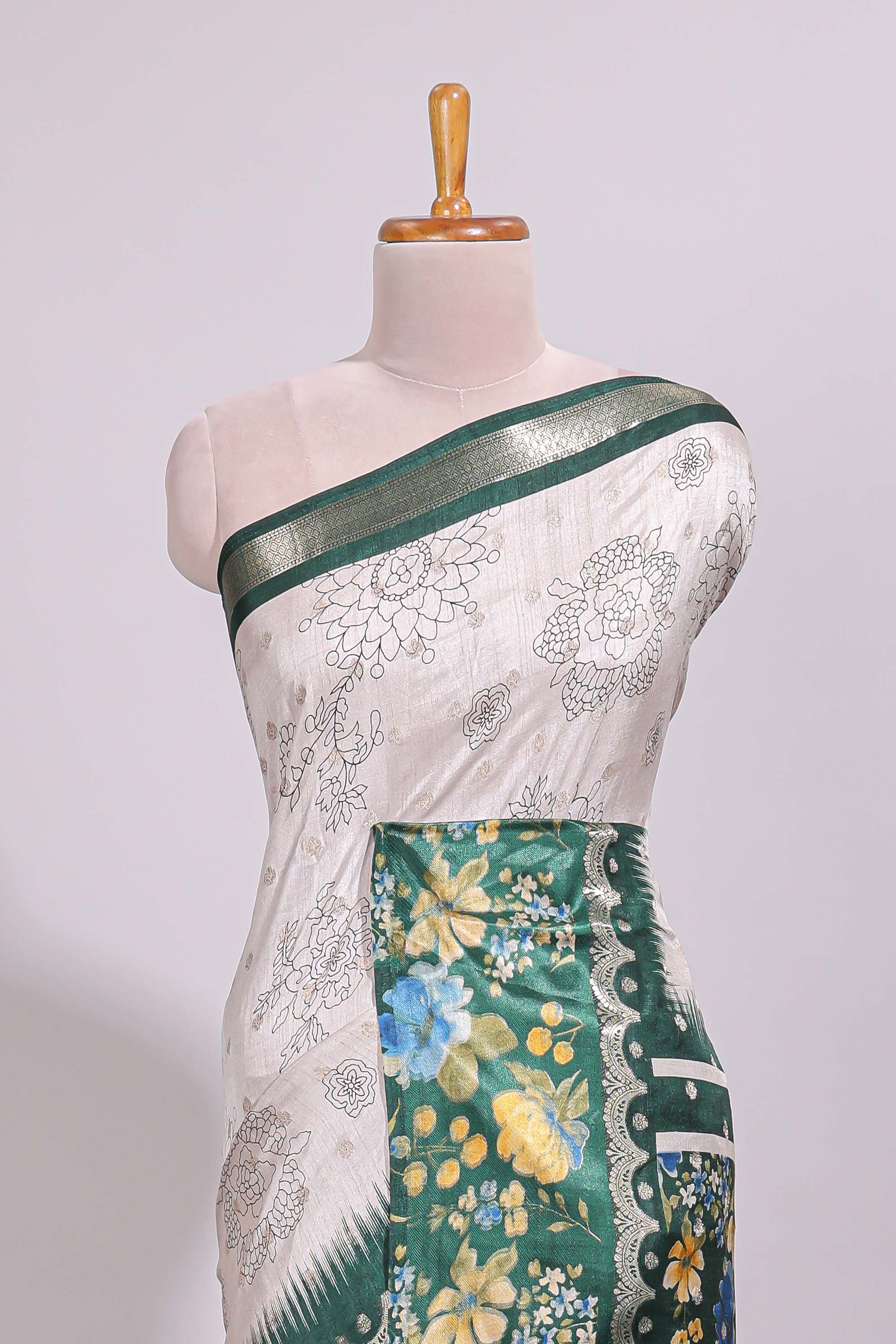 Off white floral design dola silk saree with contrast green border and printed motifs blouse