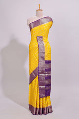 Yellow zari striped dola silk saree with contrast zari border and striped pallu