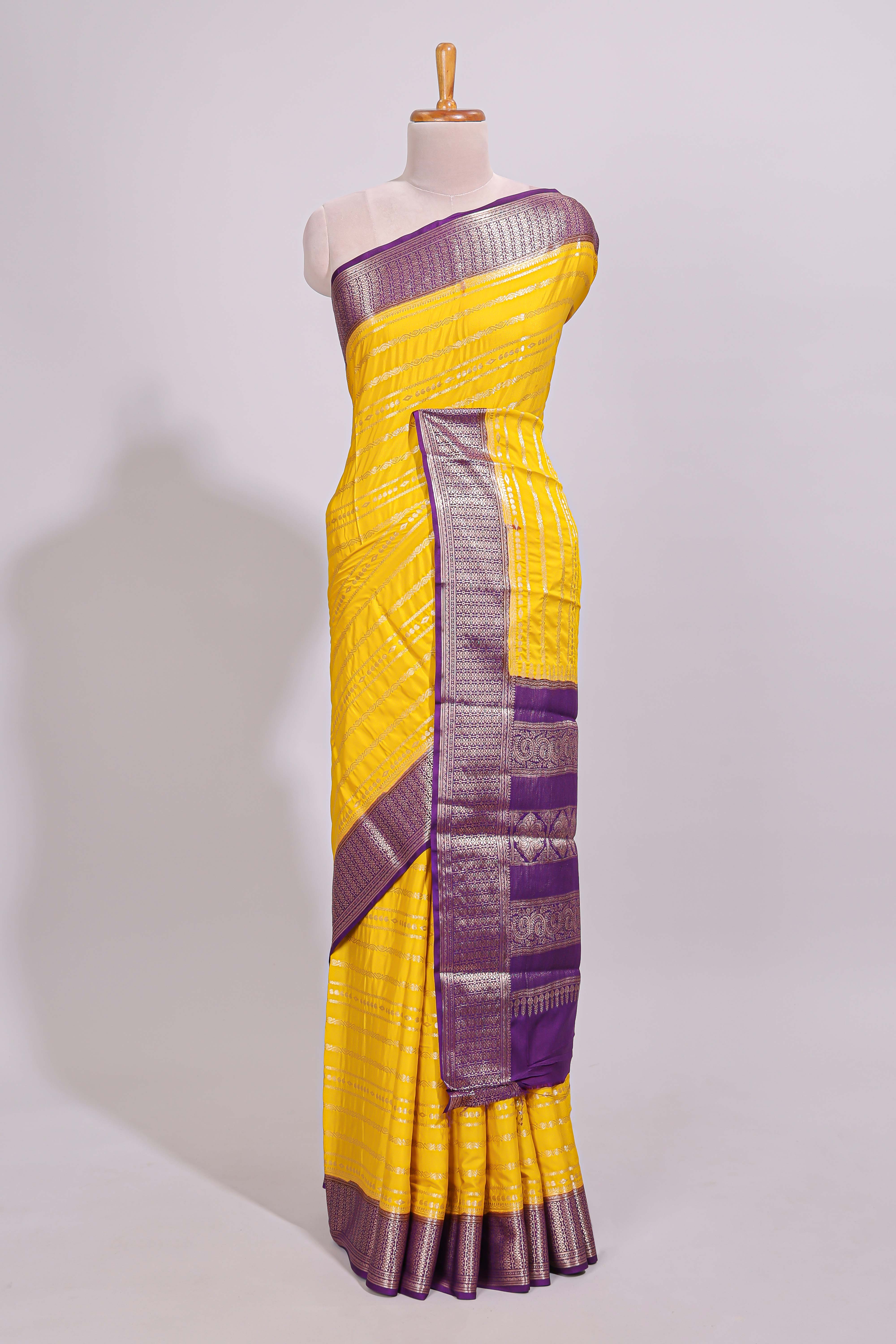 Yellow zari striped dola silk saree with contrast zari border and striped pallu