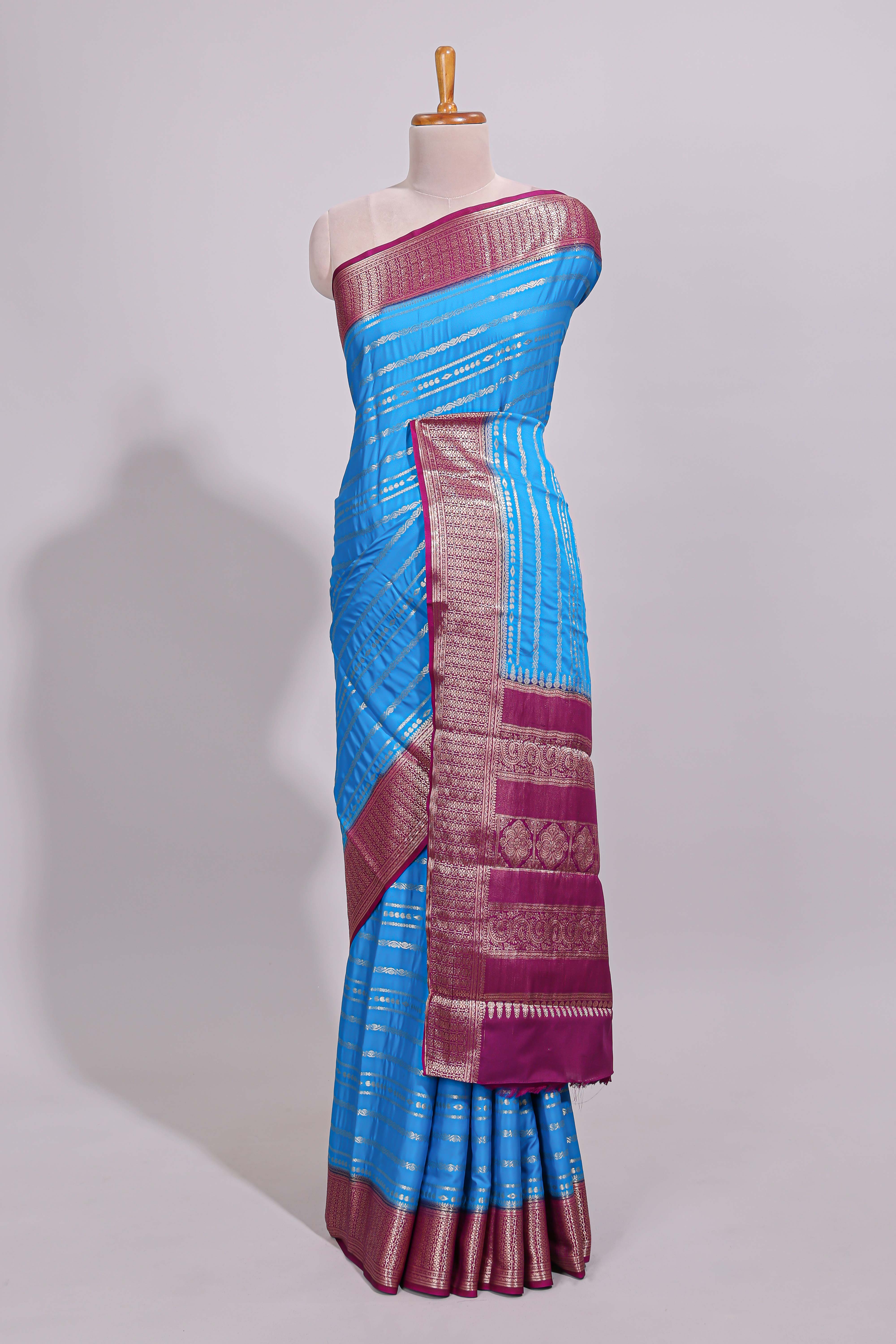 Blue zari striped dola silk saree with contrast zari border and striped pallu