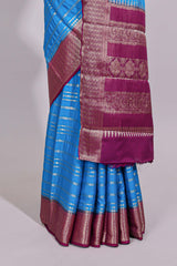 Blue zari striped dola silk saree with contrast zari border and striped pallu