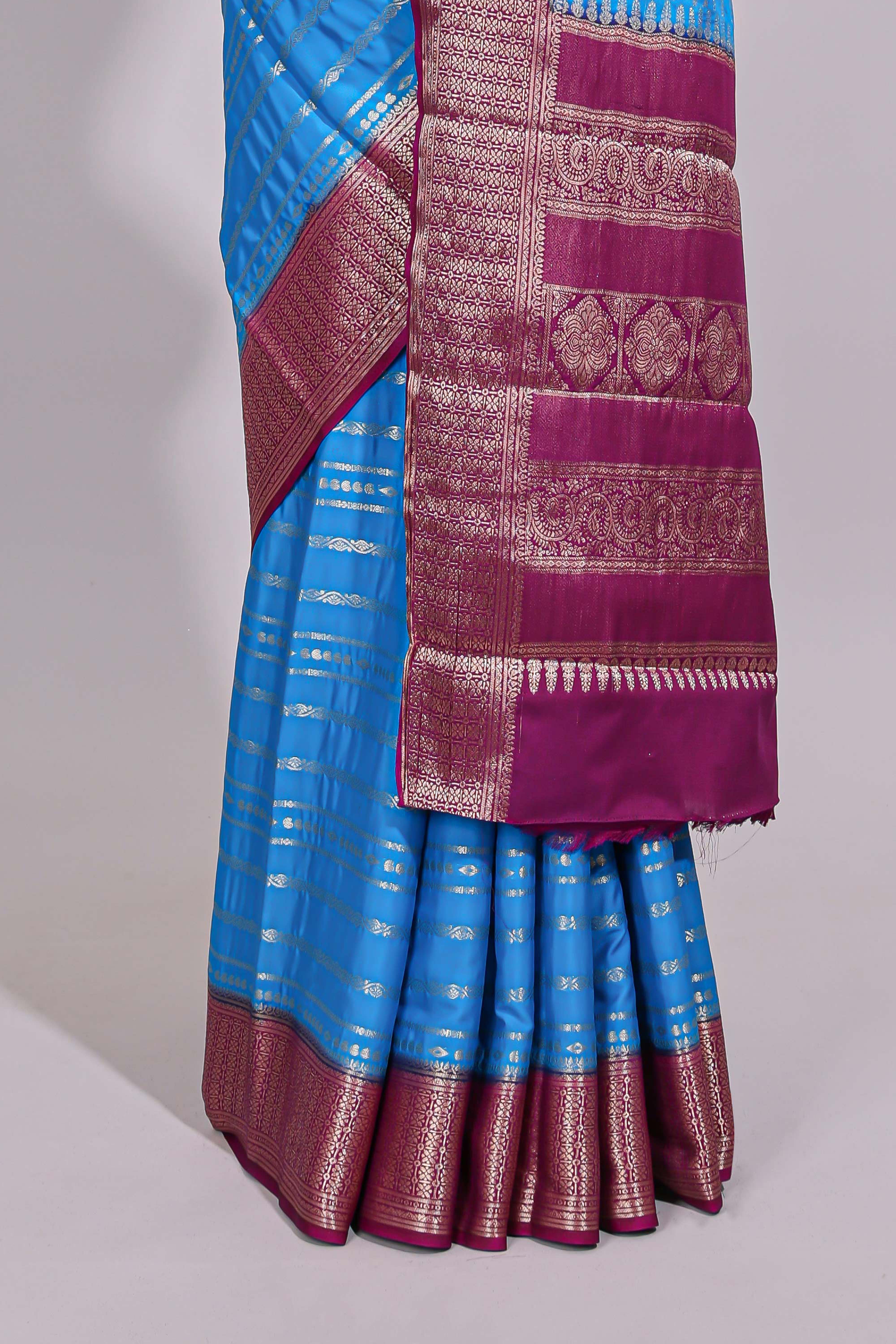 Blue zari striped dola silk saree with contrast zari border and striped pallu