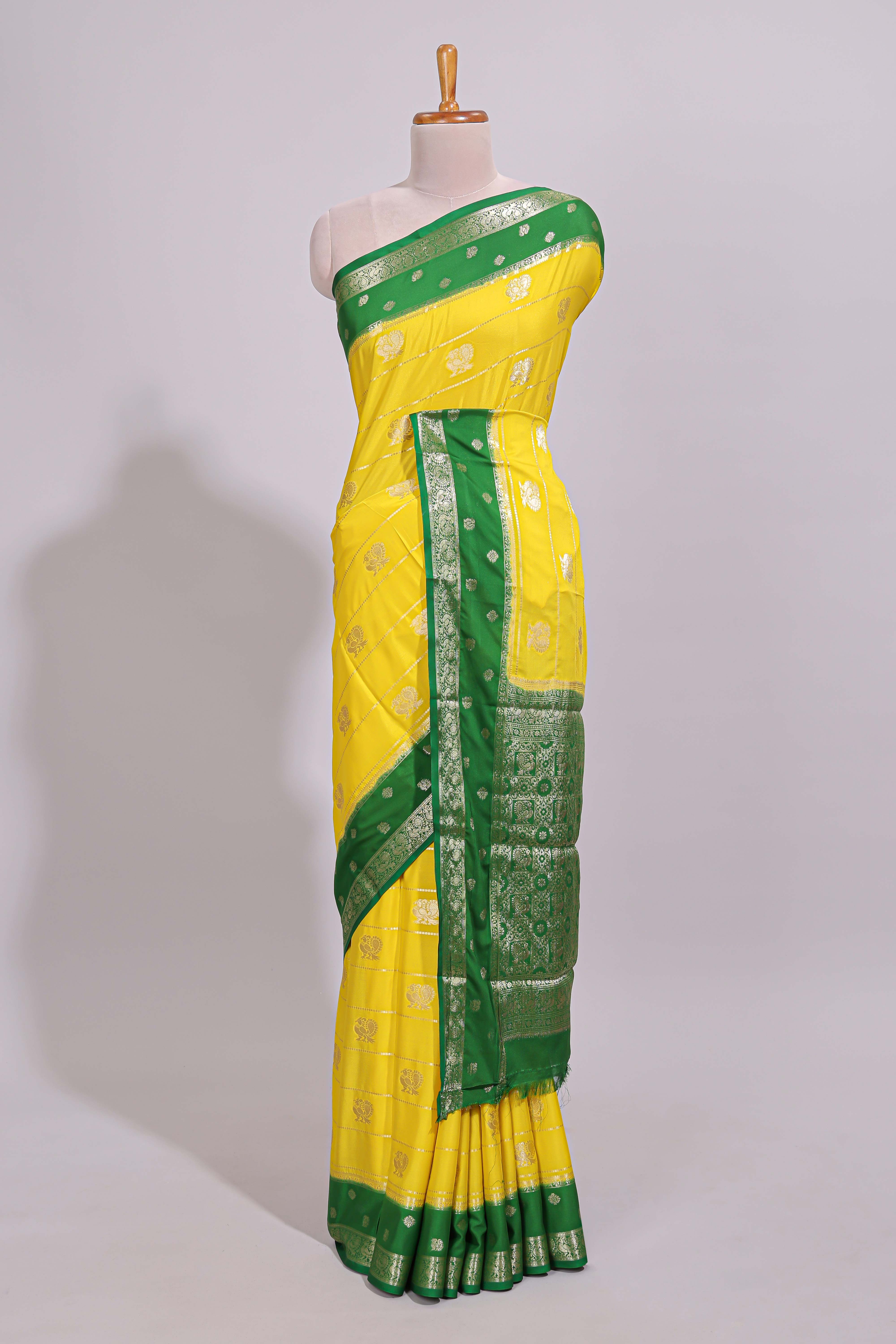 Yellow striped bird zari butta dola silk saree with contrast zari border and blouse