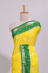 Yellow striped bird zari butta dola silk saree with contrast zari border and blouse