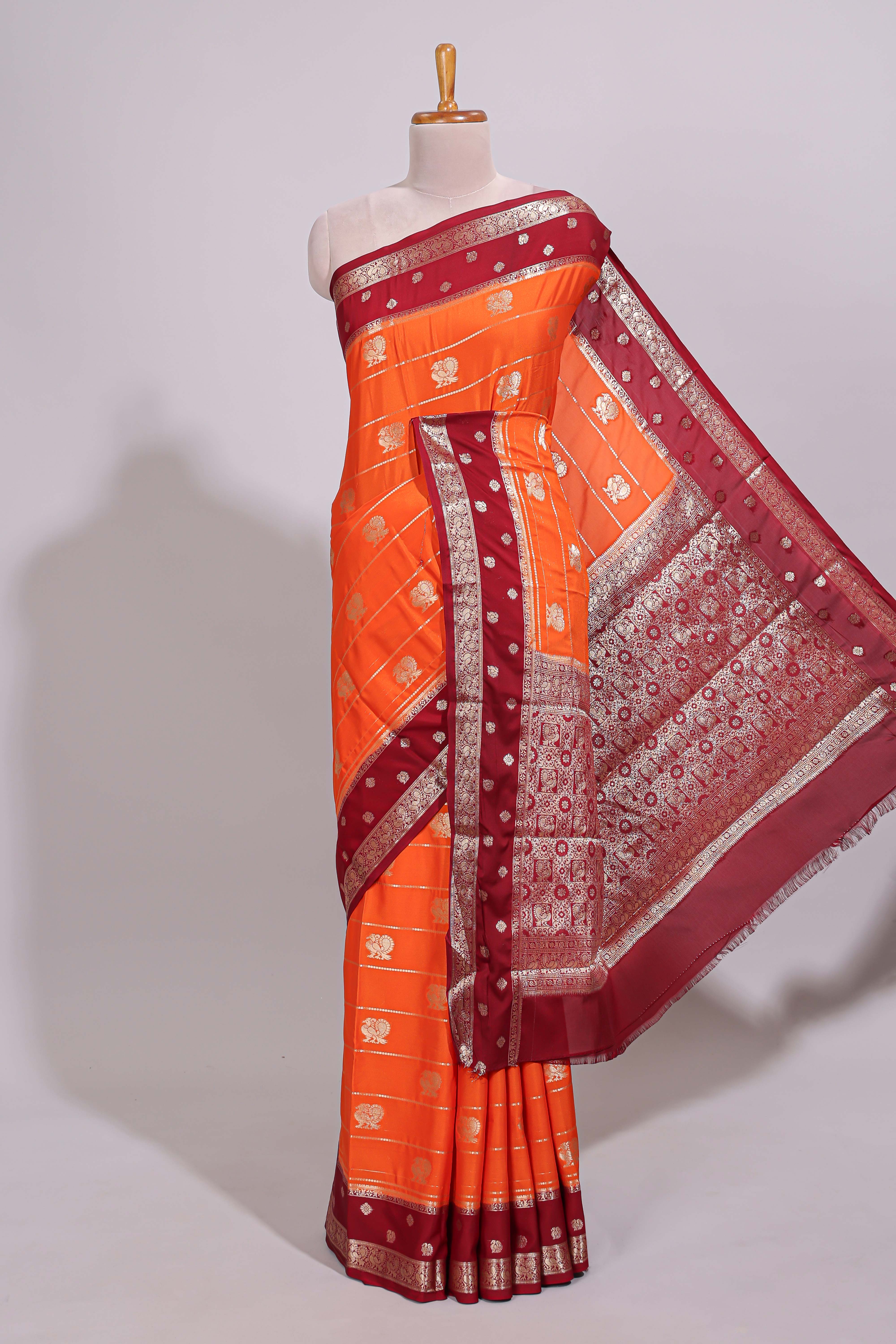 Orange striped bird zari butta dola silk saree with contrast zari border and blouse