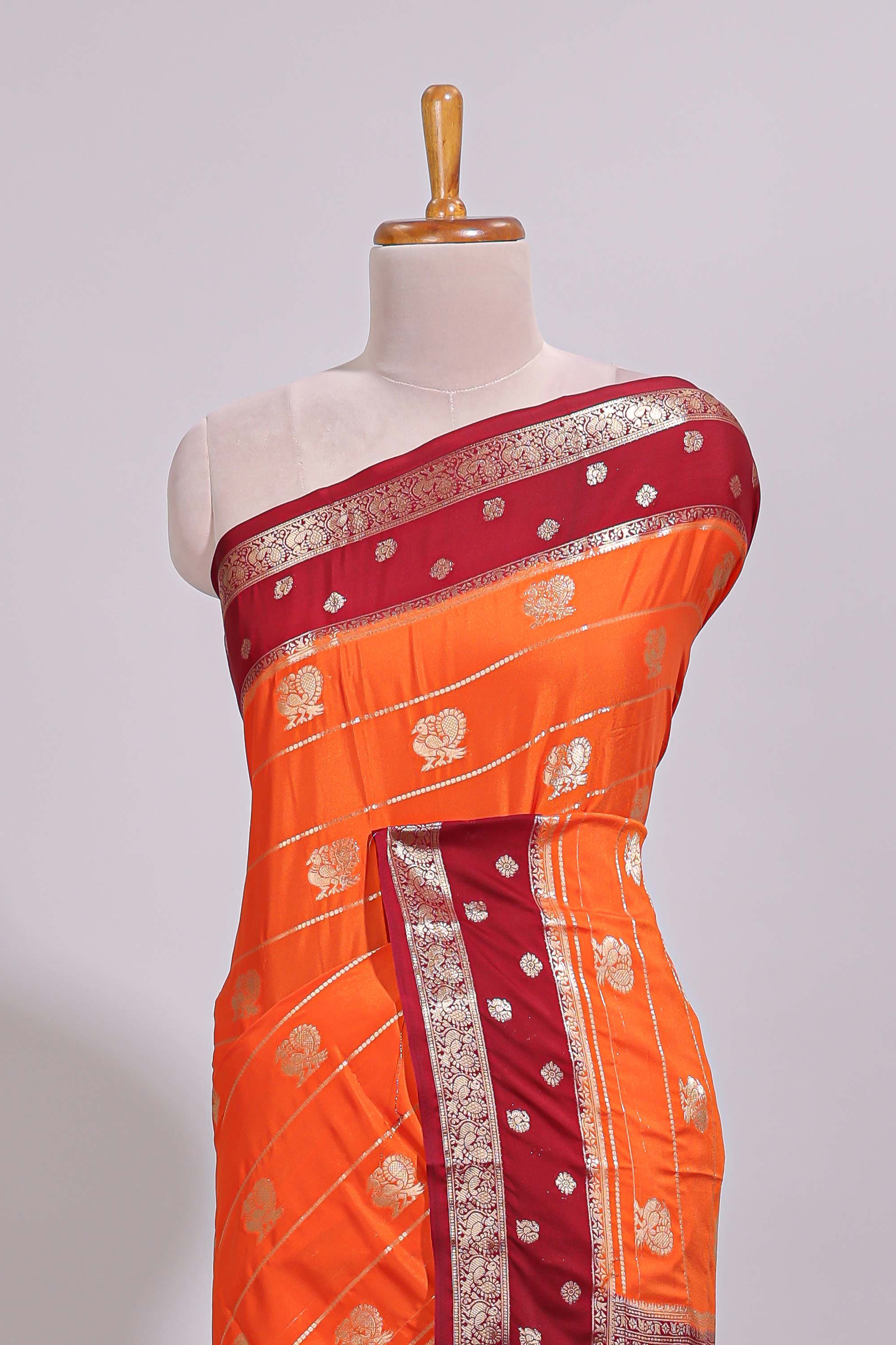 Orange striped bird zari butta dola silk saree with contrast zari border and blouse