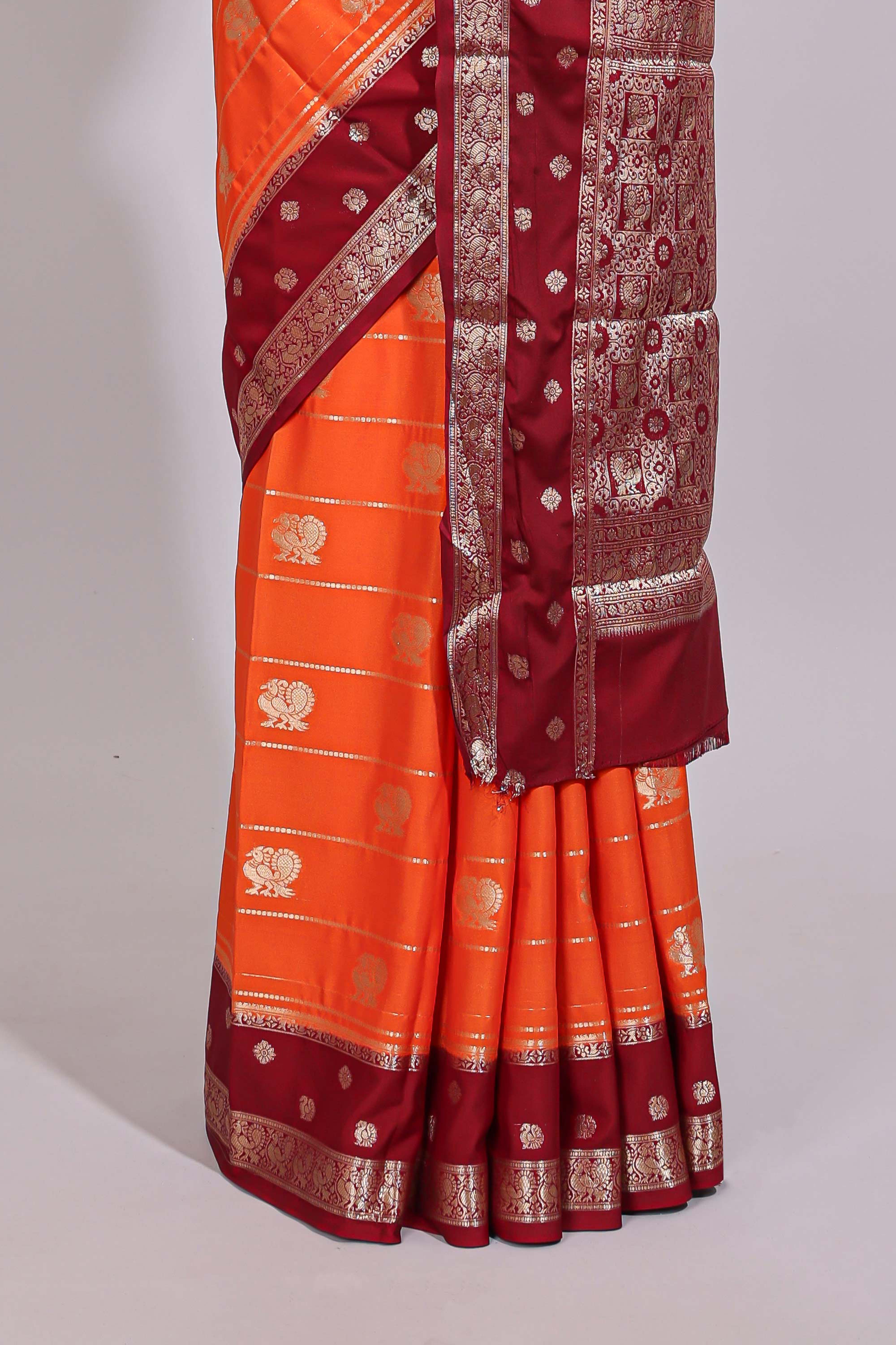 Orange striped bird zari butta dola silk saree with contrast zari border and blouse