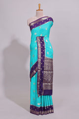 Turquoise blue striped bird zari butta dola silk saree with contrast zari border and blouse