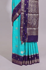 Turquoise blue striped bird zari butta dola silk saree with contrast zari border and blouse