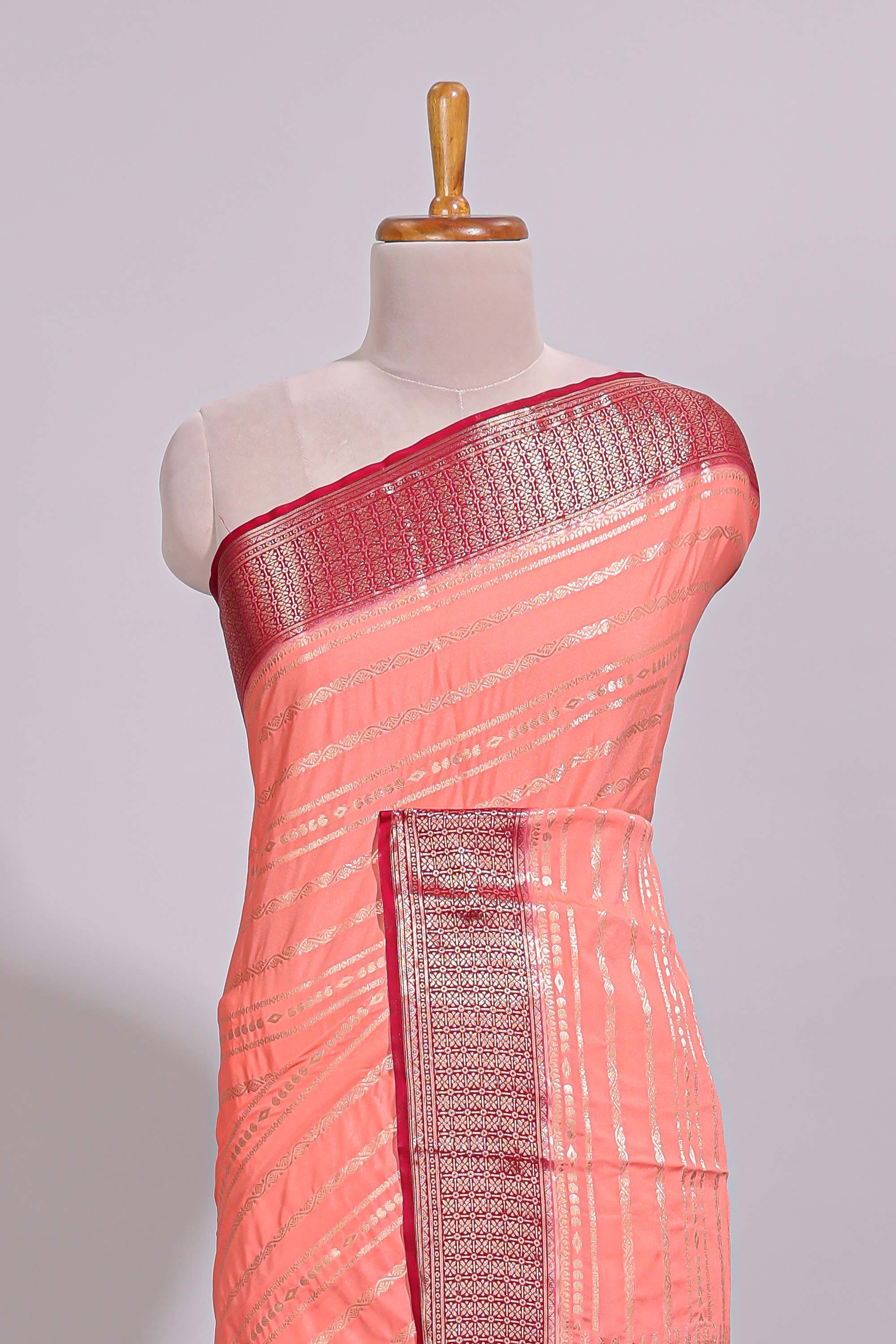 Peach zari striped dola silk saree with contrast zari border and striped pallu