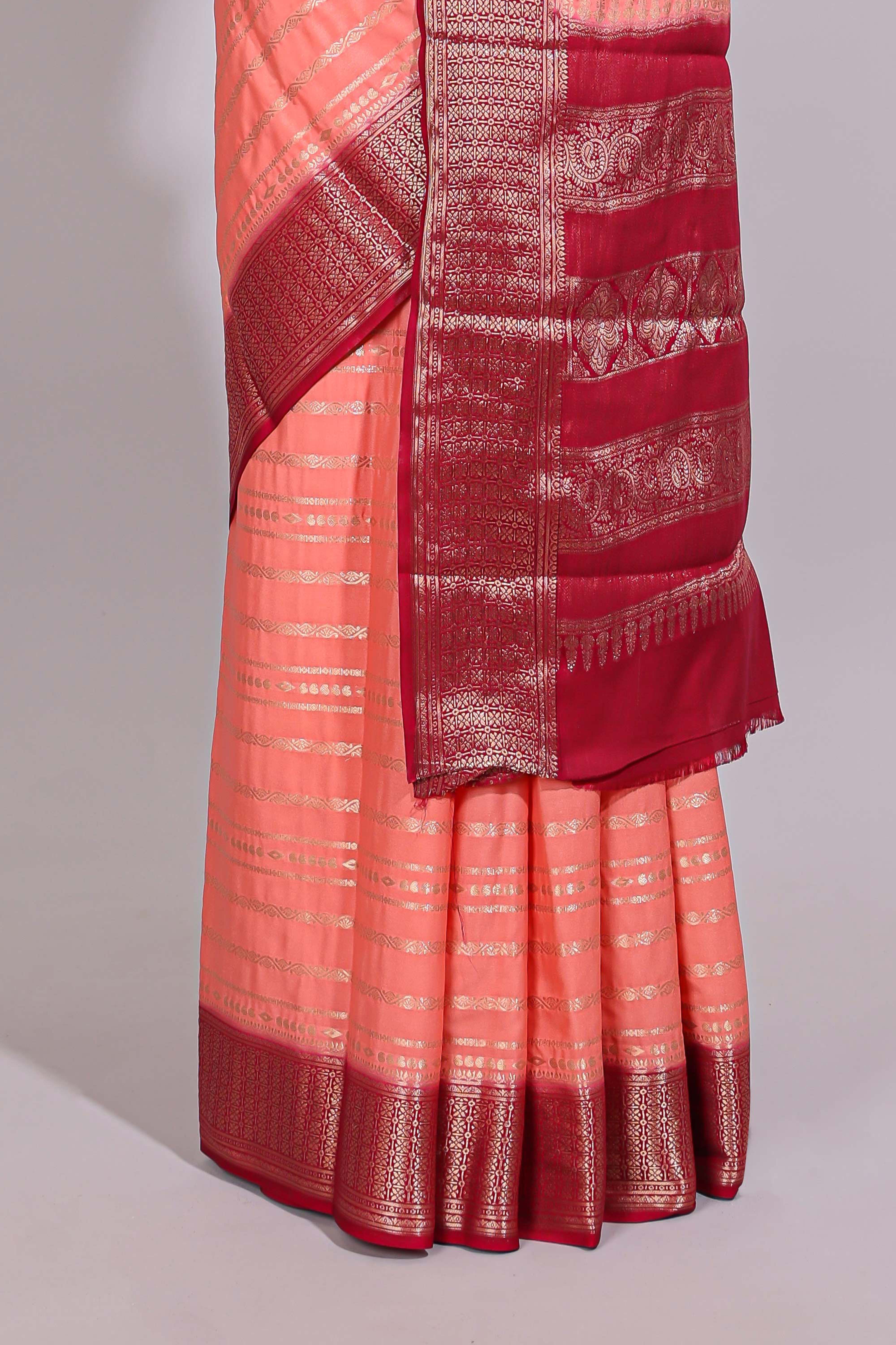 Peach zari striped dola silk saree with contrast zari border and striped pallu