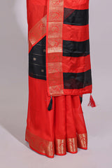 Black zari striped motifs dola silk saree with contrast red border and zari motifs blouse