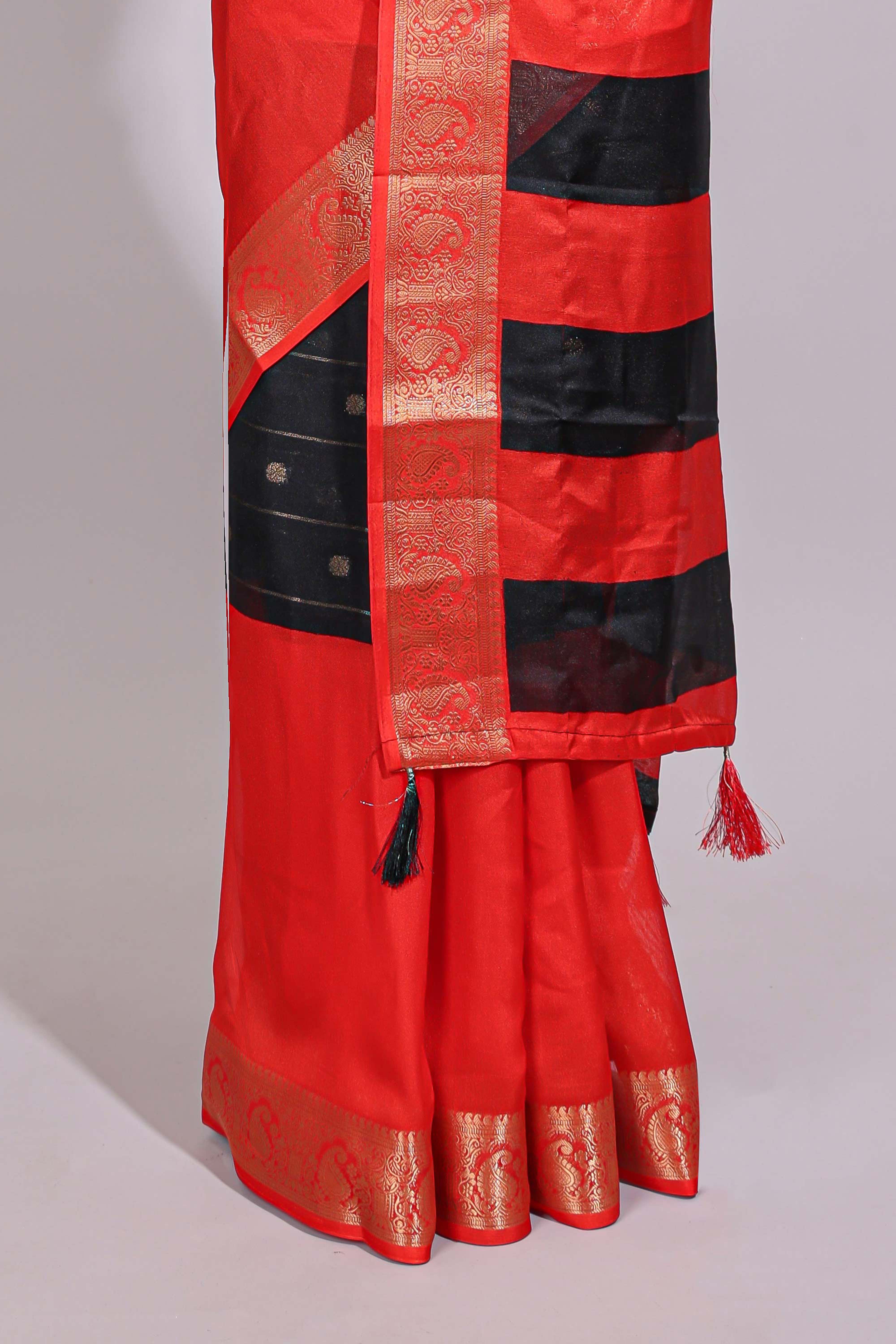 Black zari striped motifs dola silk saree with contrast red border and zari motifs blouse