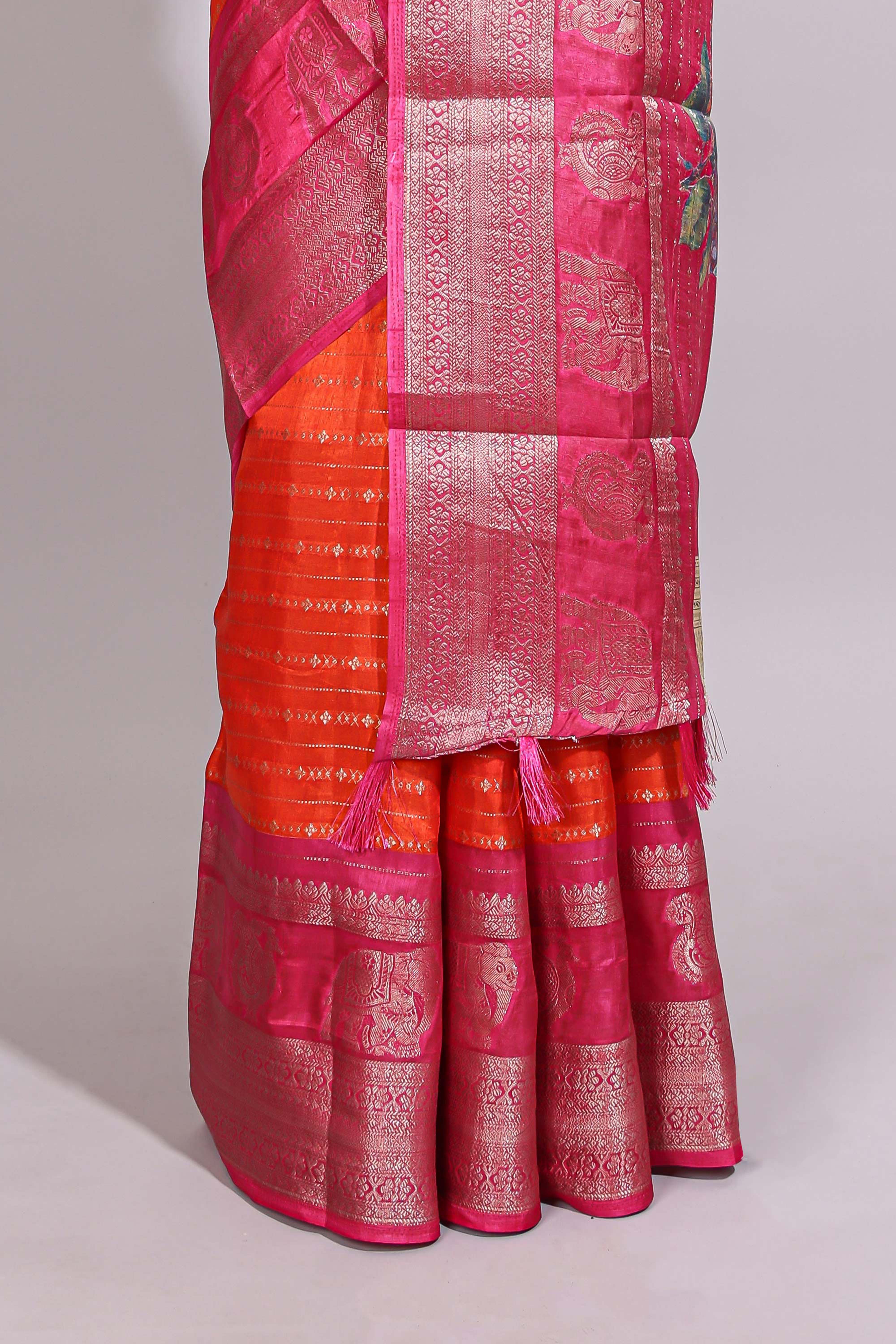 Orange zari striped dola silk saree with contrast zari border and floral printed pallu