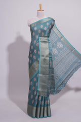 Peacock green zari butta dola silk saree with self zari border and matching zari motifs blouse