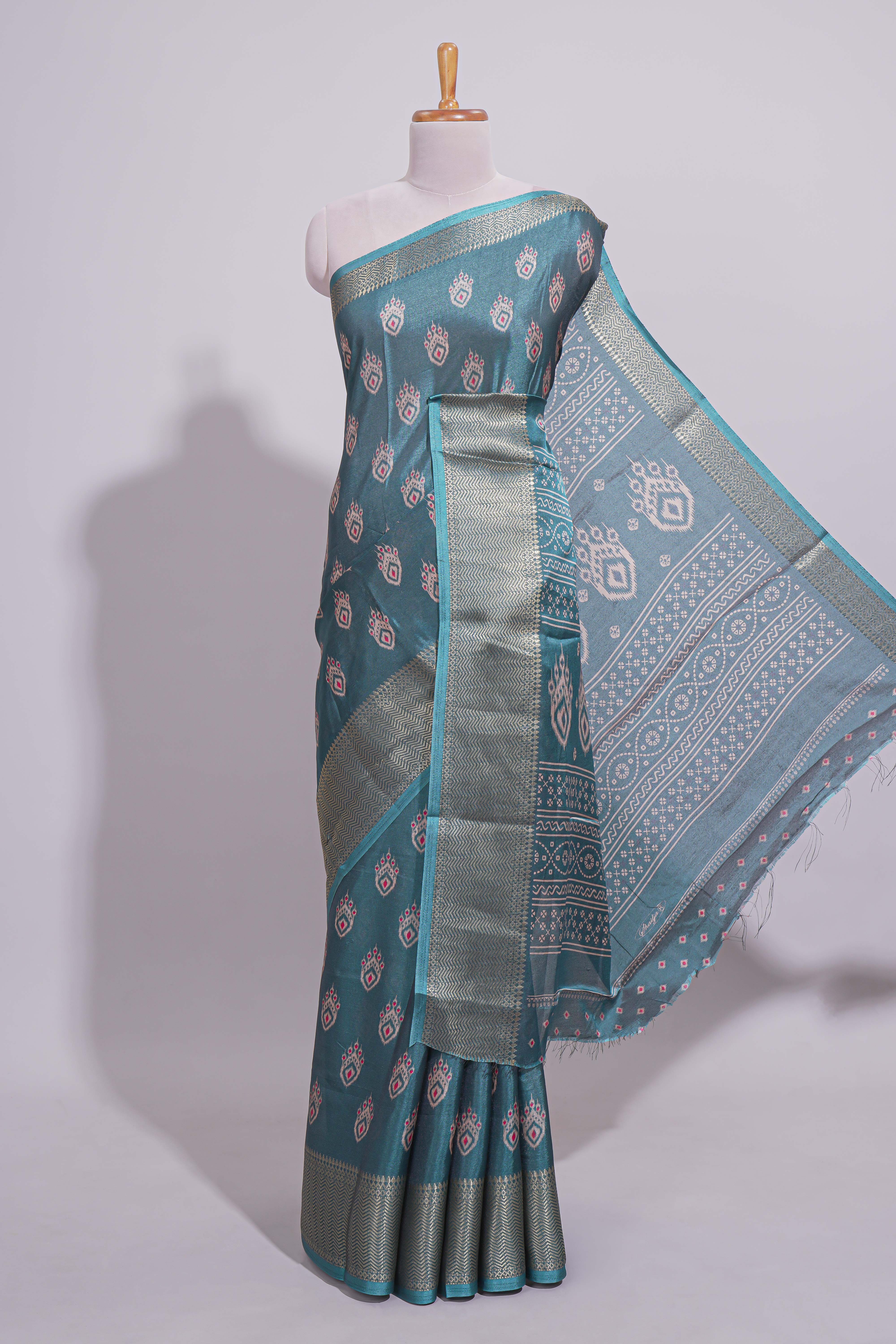 Peacock green zari butta dola silk saree with self zari border and matching zari motifs blouse
