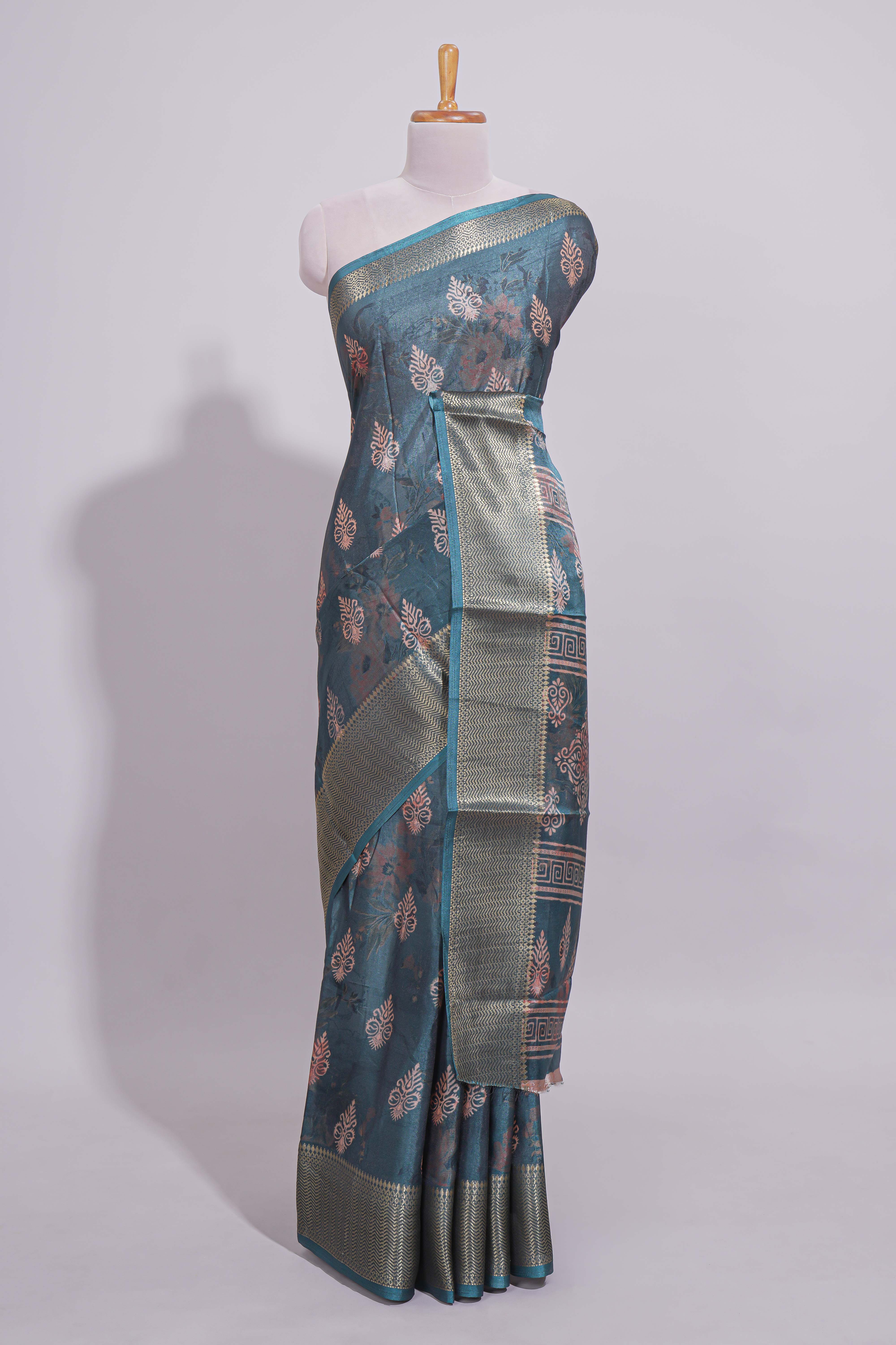 Pine green dola silk saree with all over butta self zari border and matching motifs blouse