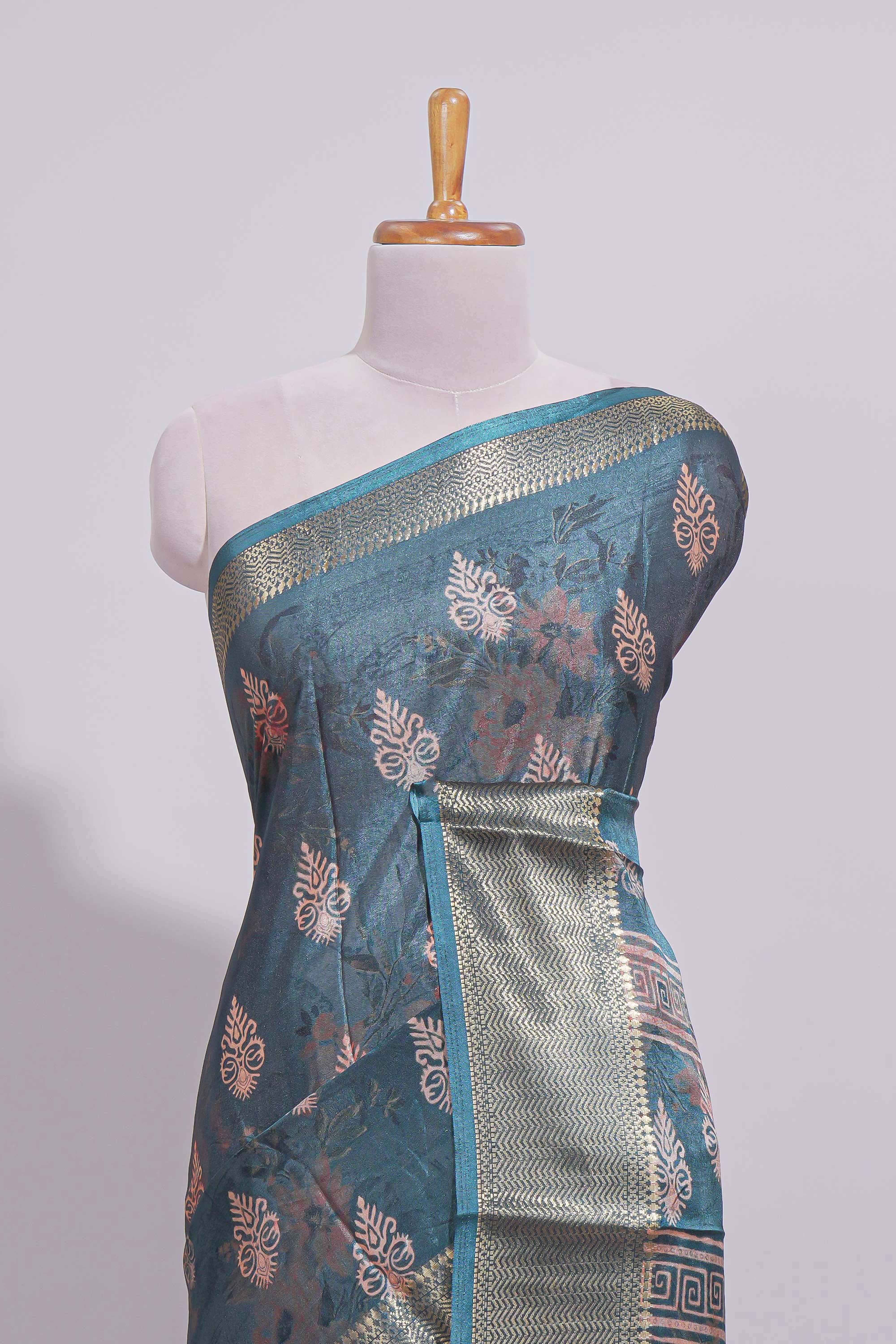 Pine green dola silk saree with all over butta self zari border and matching motifs blouse