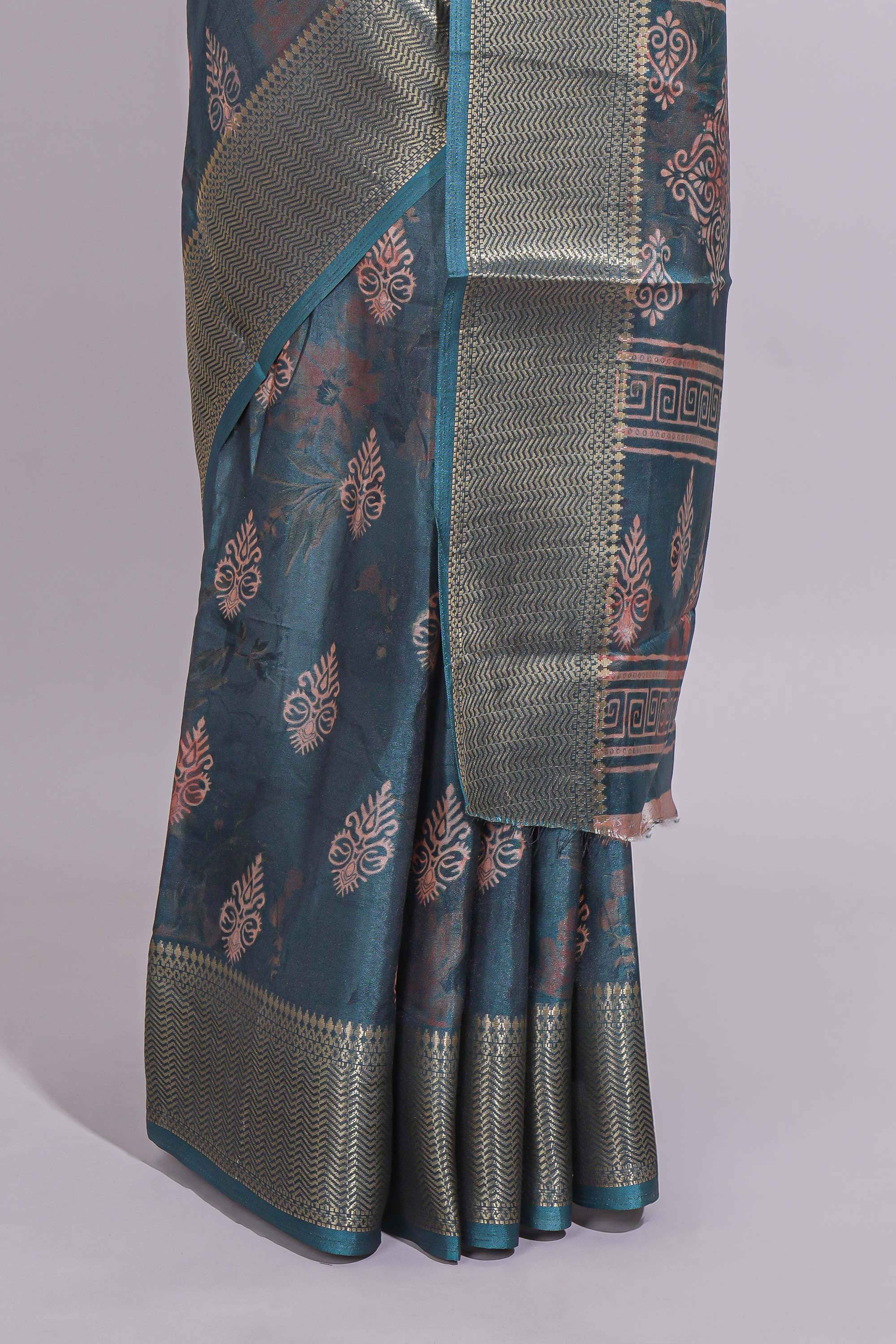 Pine green dola silk saree with all over butta self zari border and matching motifs blouse