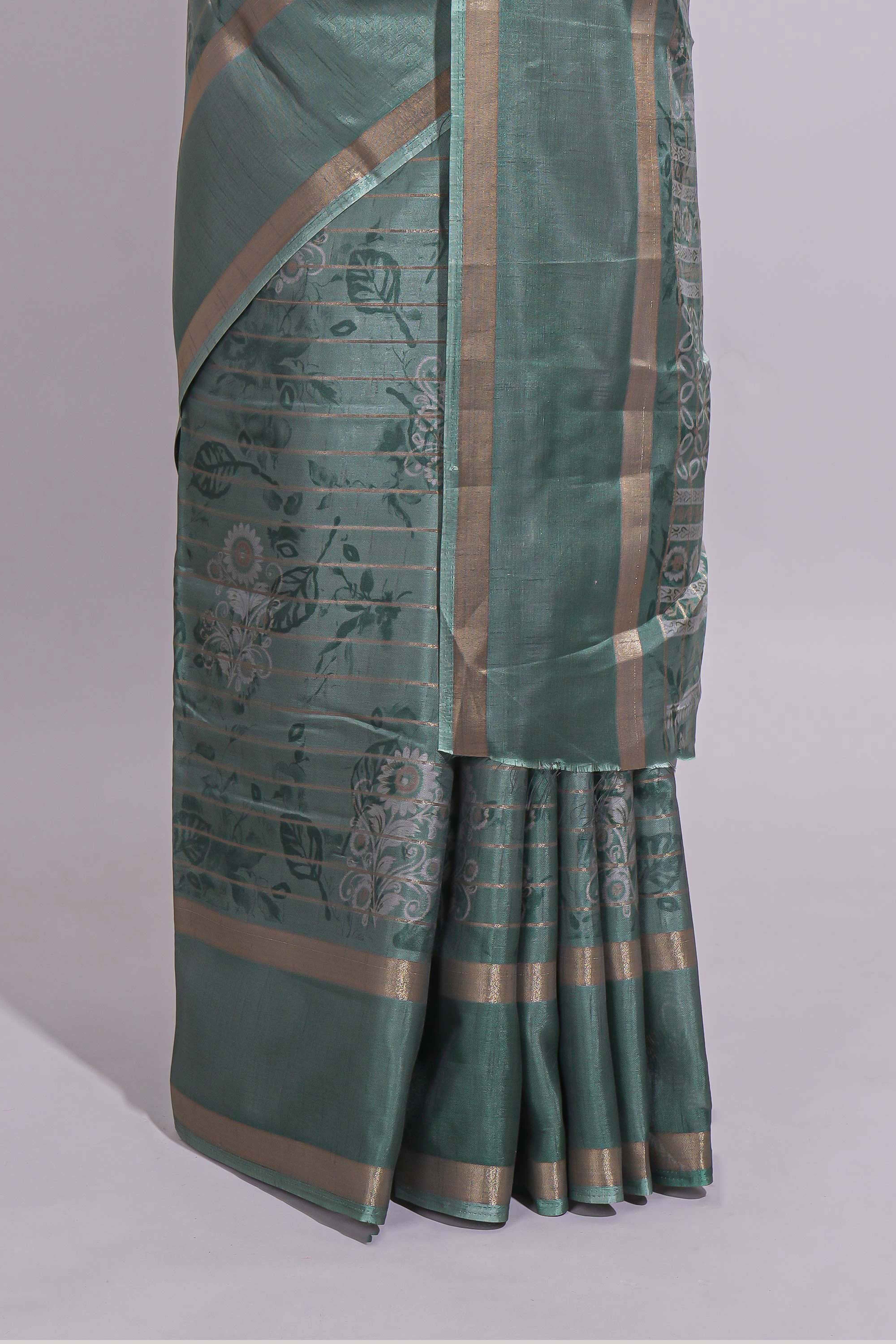 Teal green Dola Silk Saree all over floral motifs fine zari stripes and zari border with matching printed blouse