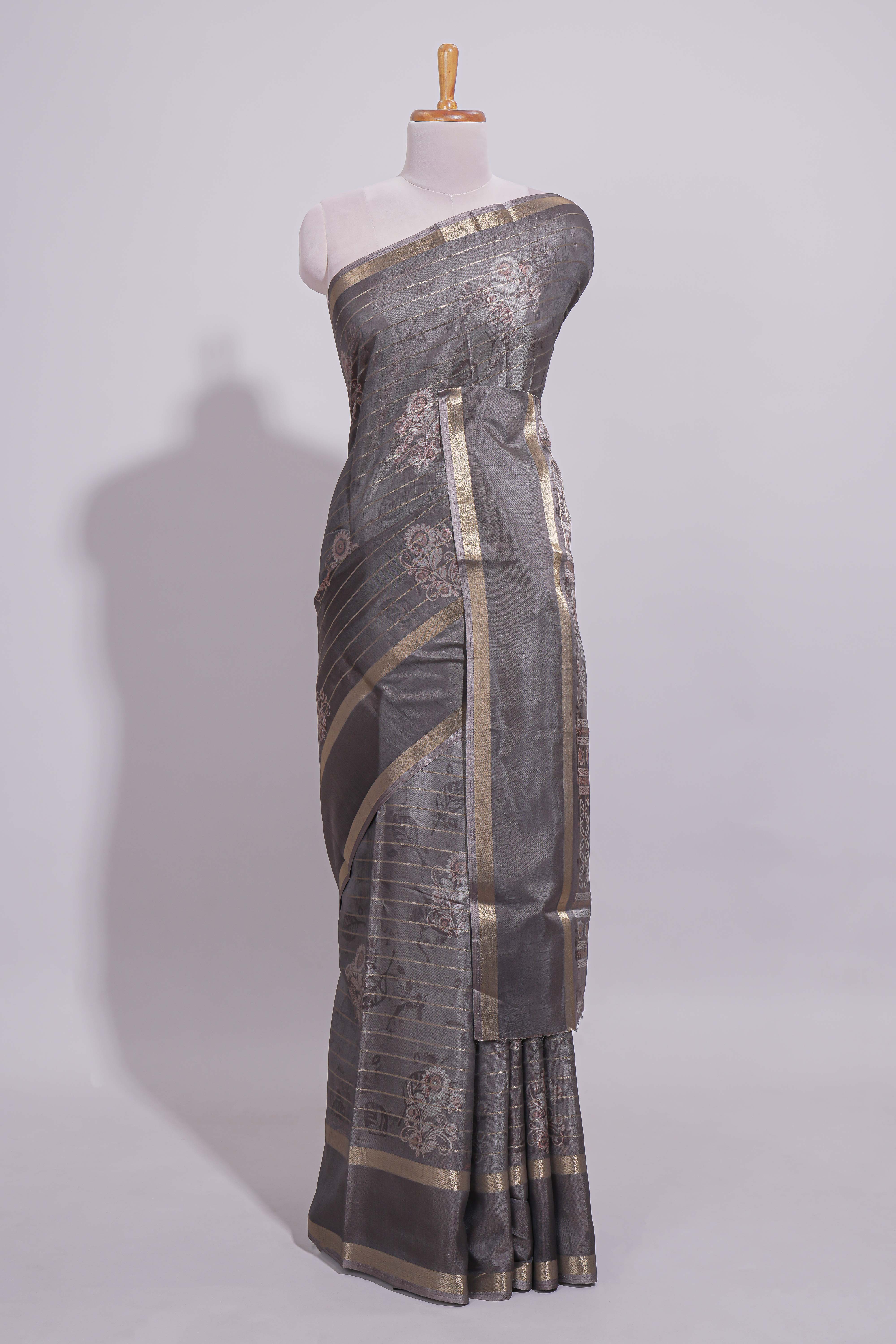 Charcoal Grey Dola Silk Saree all over floral motifs fine zari stripes and zari border with matching printed blouse