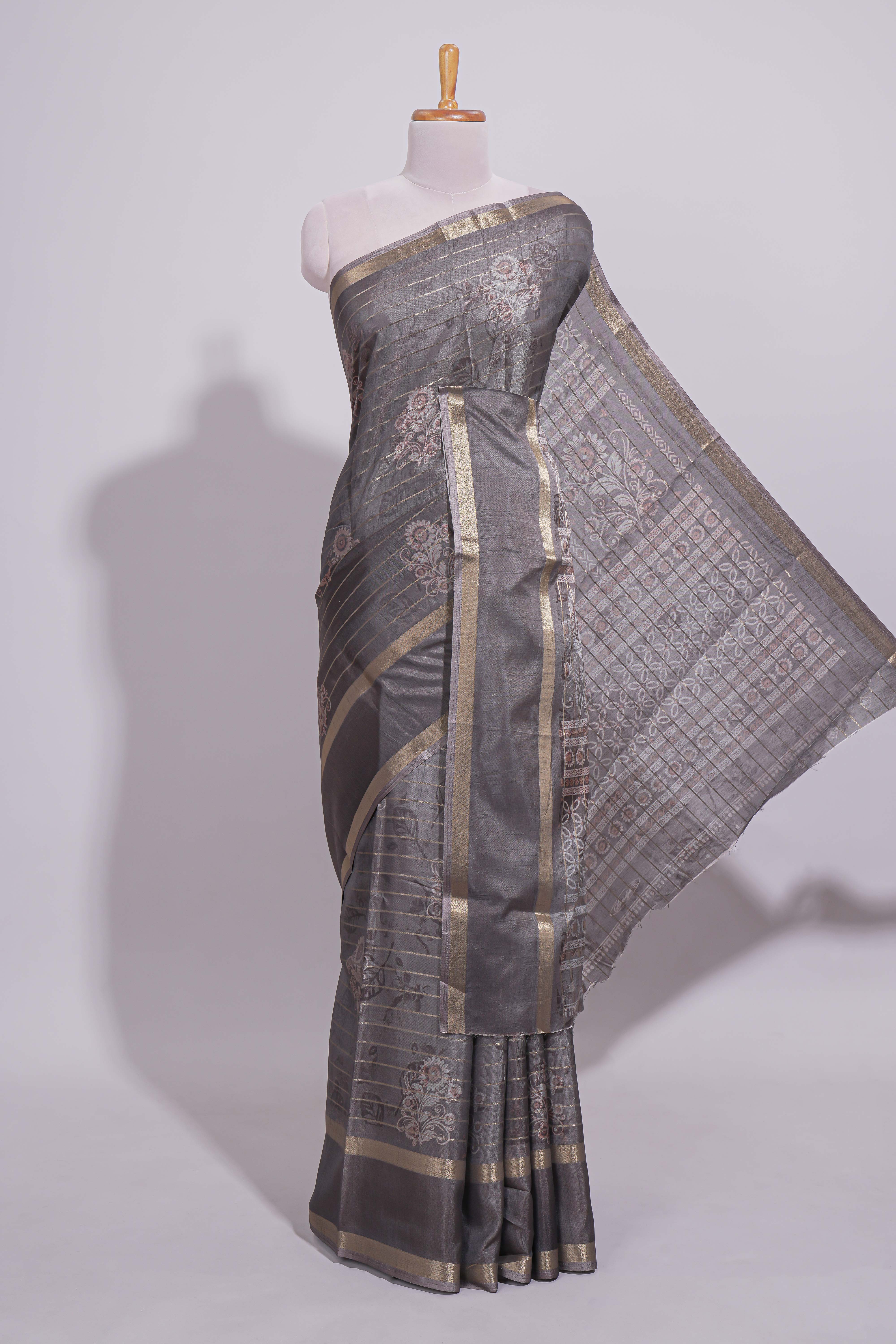 Charcoal Grey Dola Silk Saree all over floral motifs fine zari stripes and zari border with matching printed blouse
