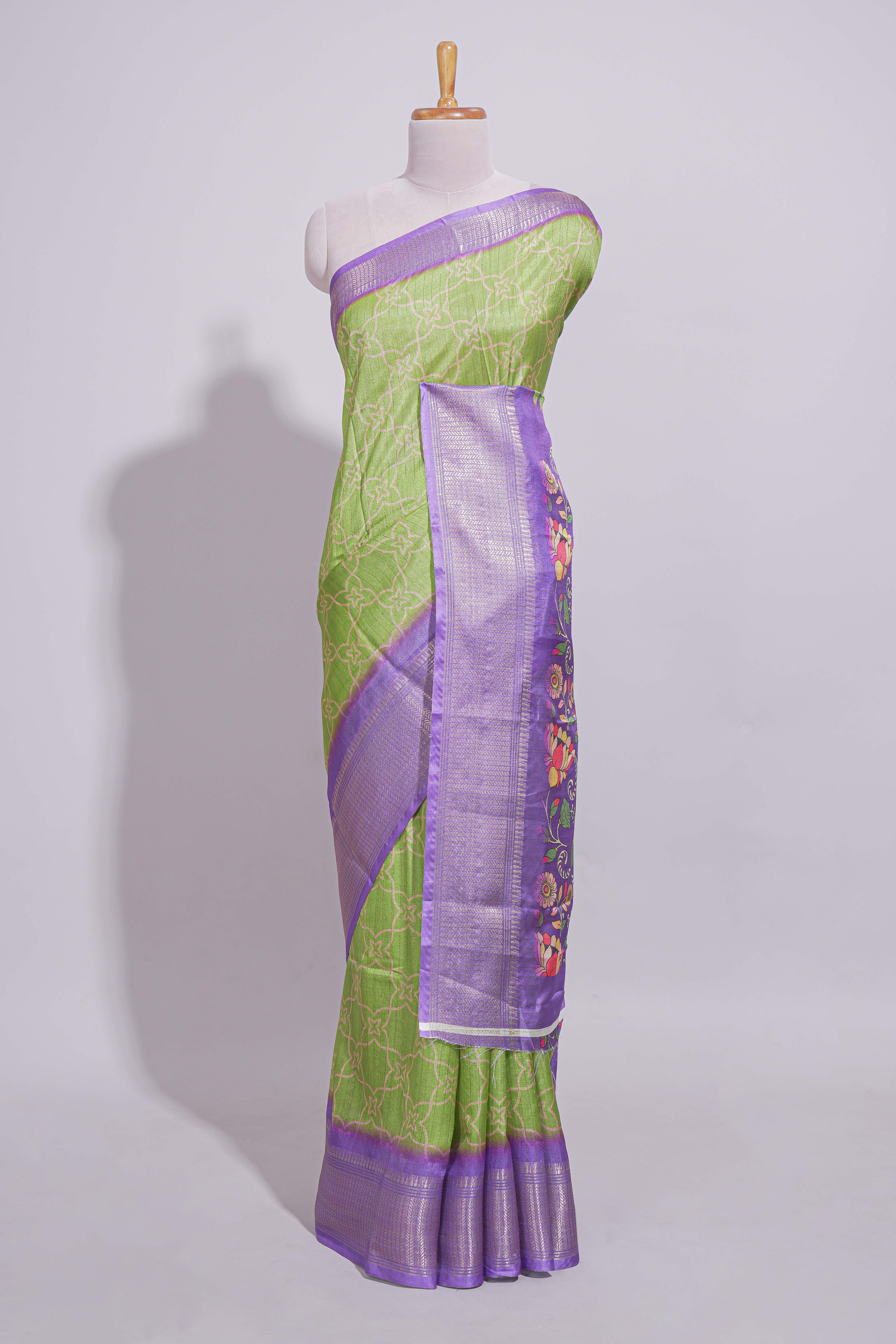 Green striped zari design dola silk saree with contrast zari border and floral design blouse