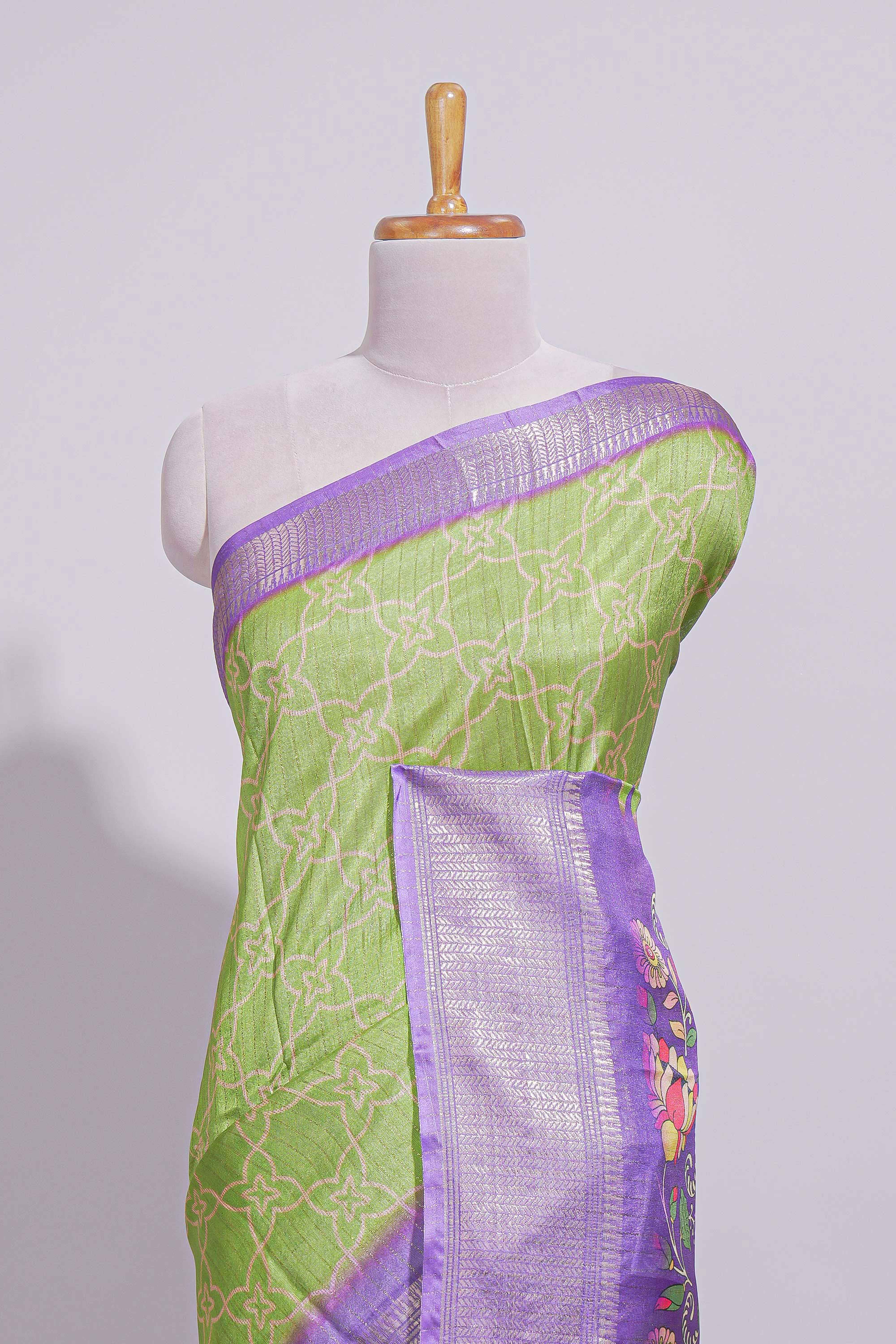 Green striped zari design dola silk saree with contrast zari border and floral design blouse