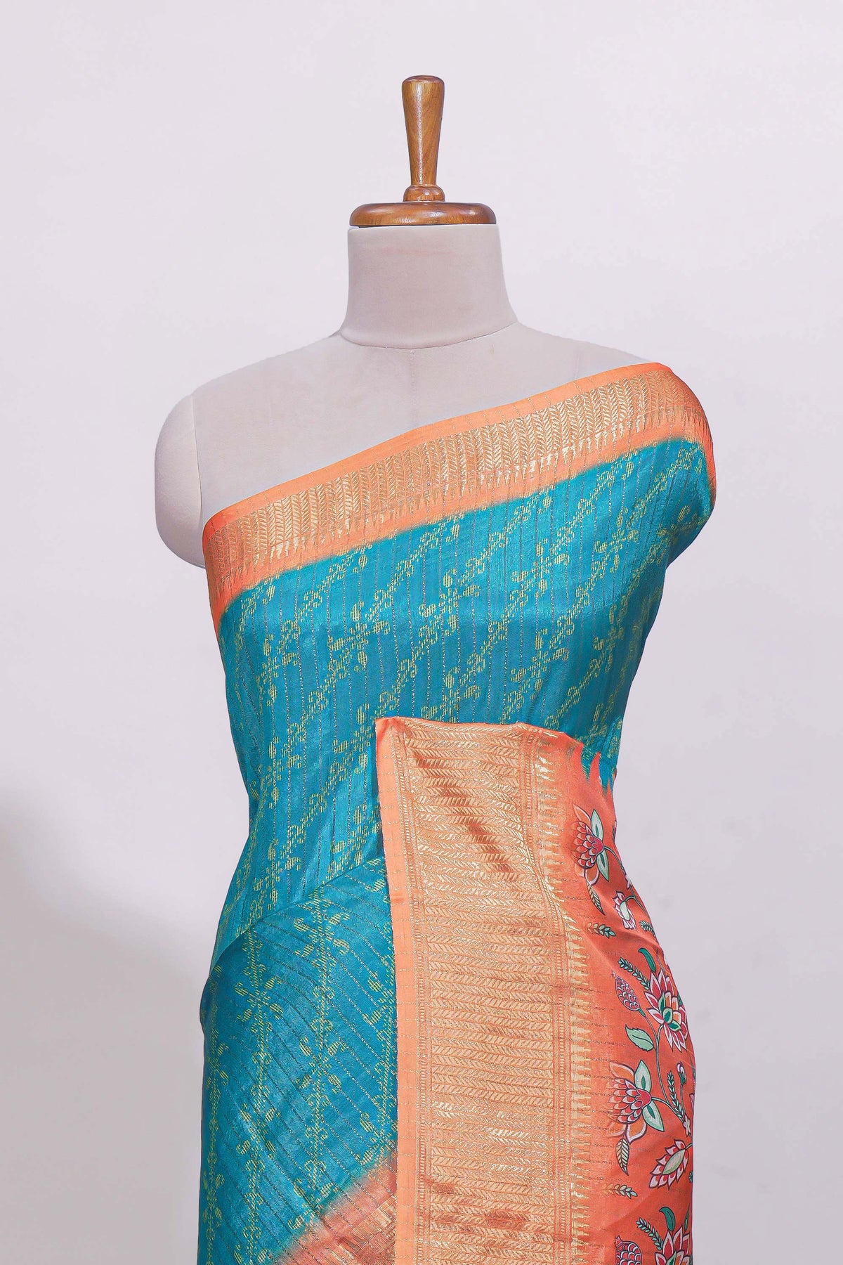 Teal blue striped dola Saree with contrast border and floral pallu along with contrast blouse