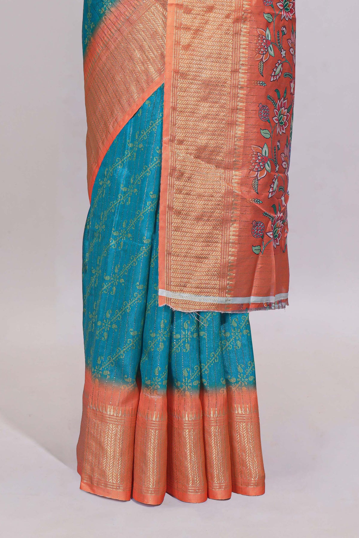 Teal blue striped dola Saree with contrast border and floral pallu along with contrast blouse