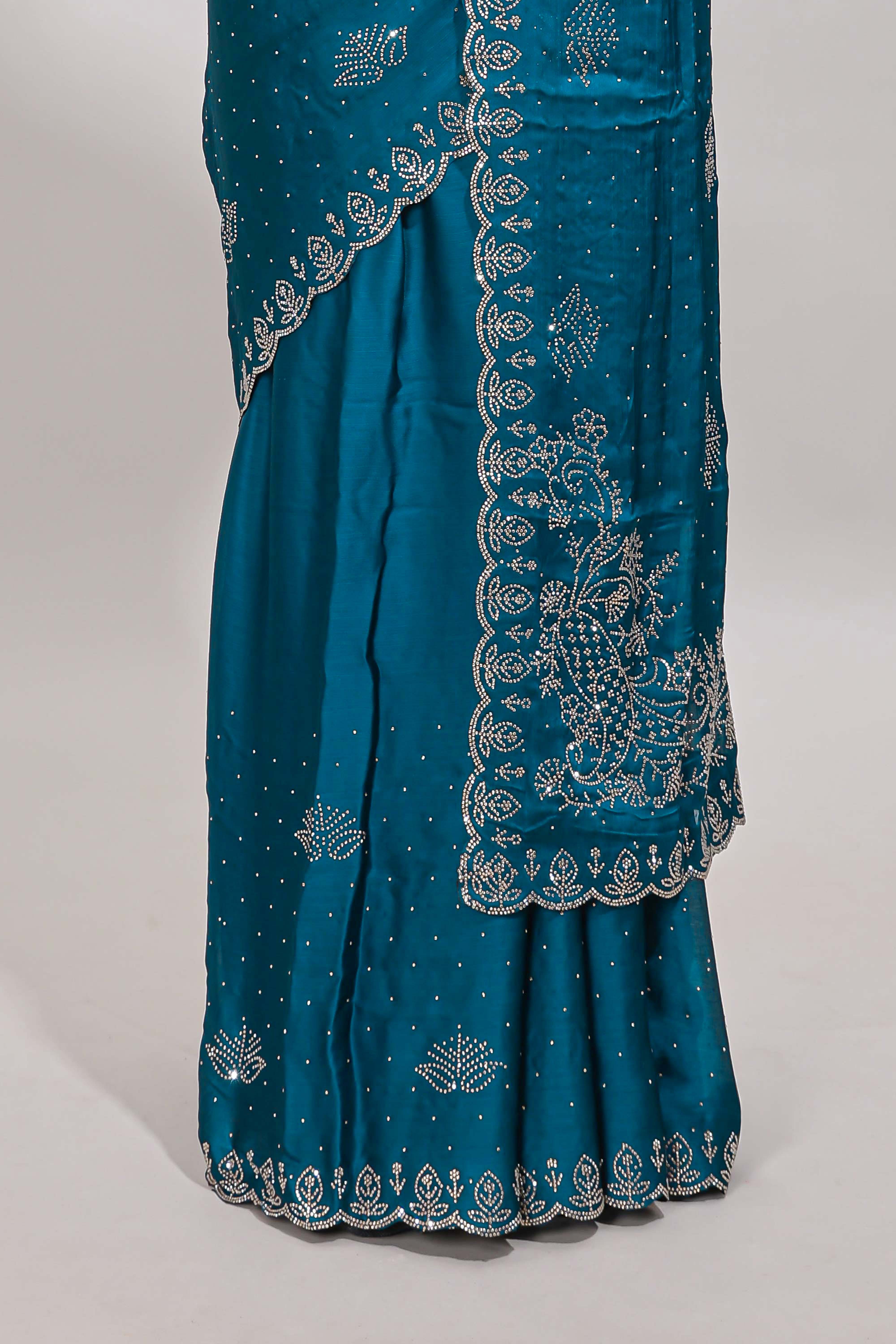 Midight green floral motifs design stone work designer saree with self floral scallop border and matching blouse