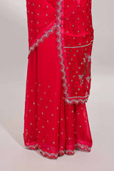 Pink stone work floral motifs designer saree with self design scallop border and matching blouse