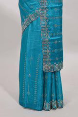 Blue striped floral design stone work designer saree with self scallop design border and matching blouse