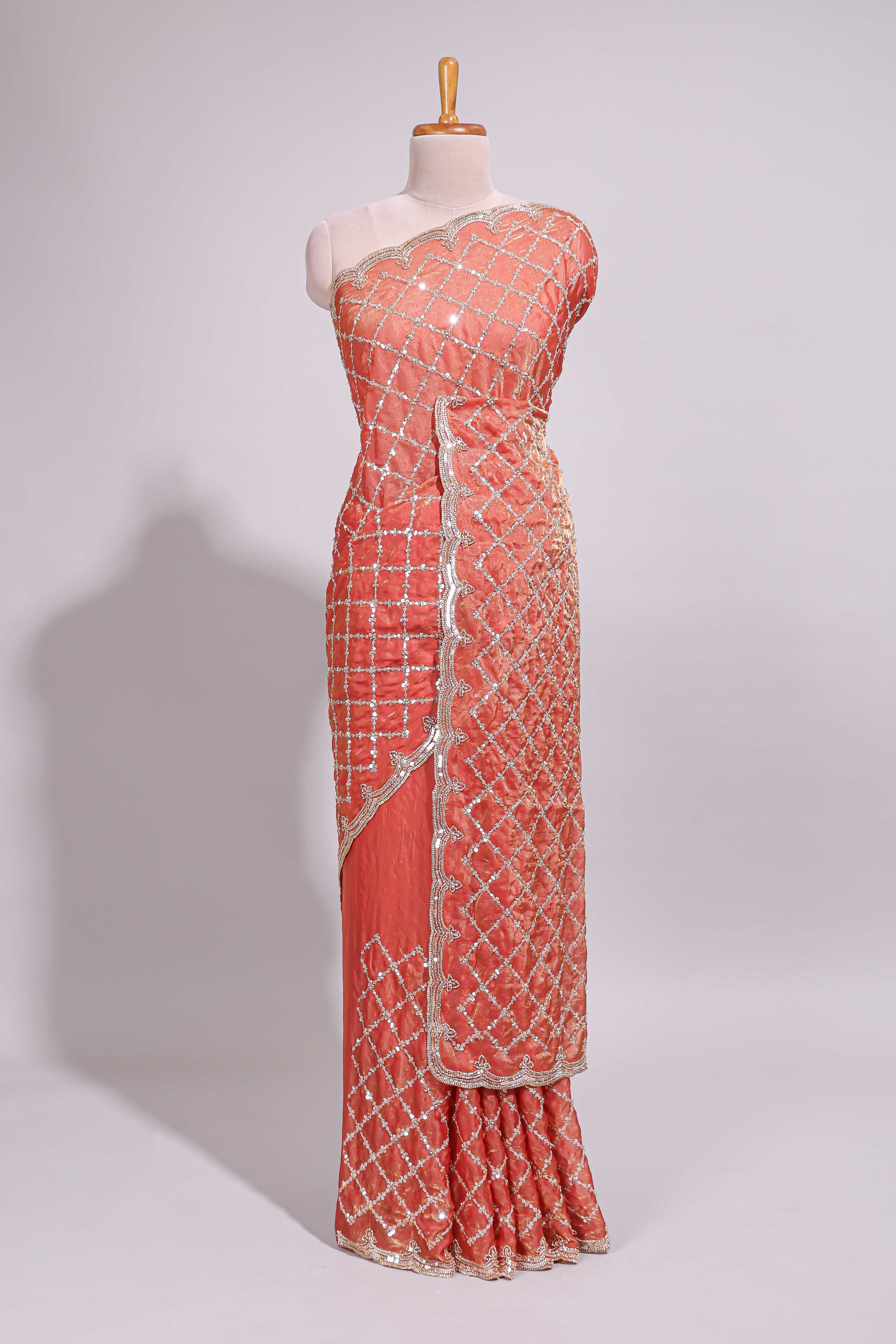 Coral pink saree with elegant silver sequin diamond embroidery featuring a shimmering border and pallu along with blouse