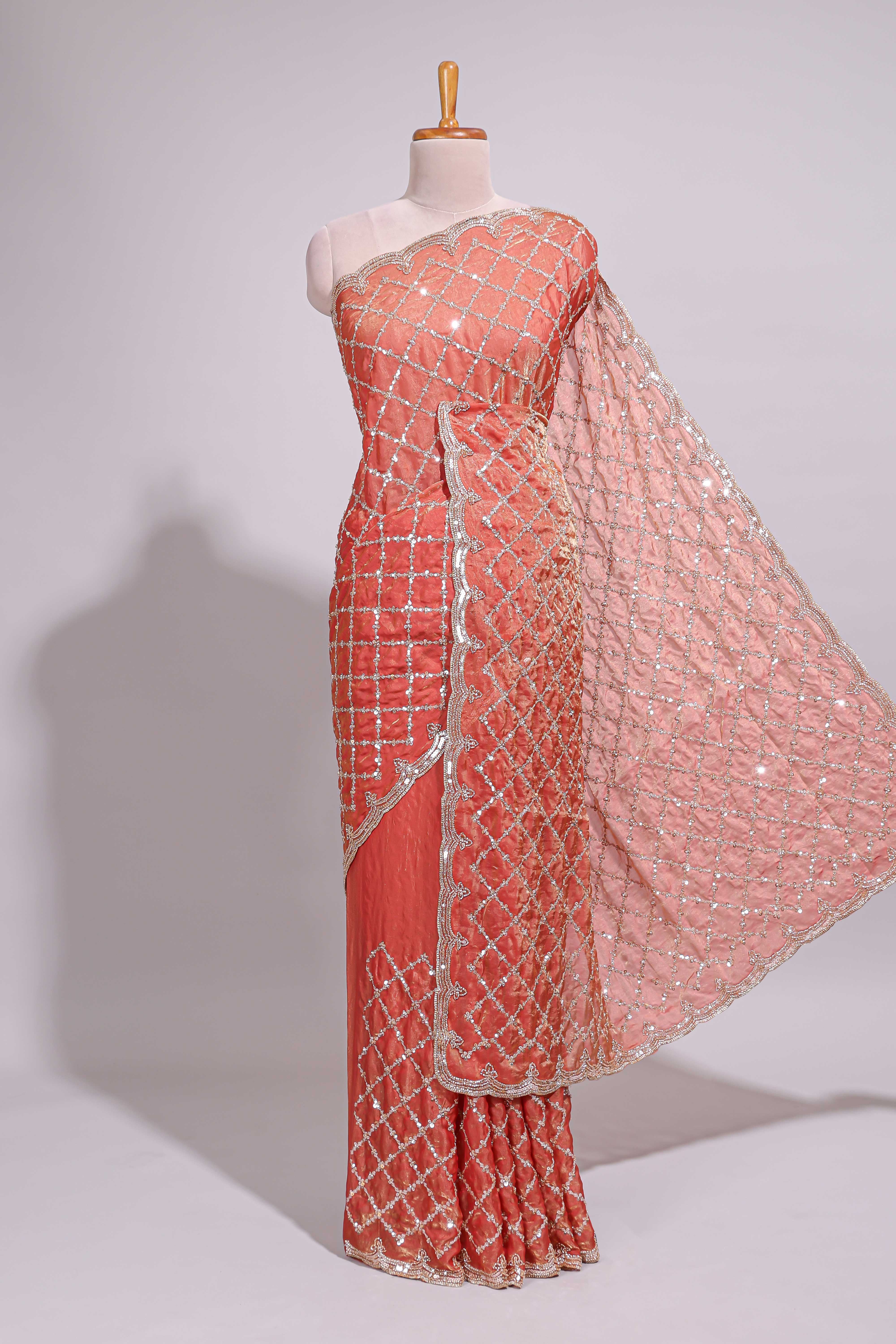 Coral pink saree with elegant silver sequin diamond embroidery featuring a shimmering border and pallu along with blouse