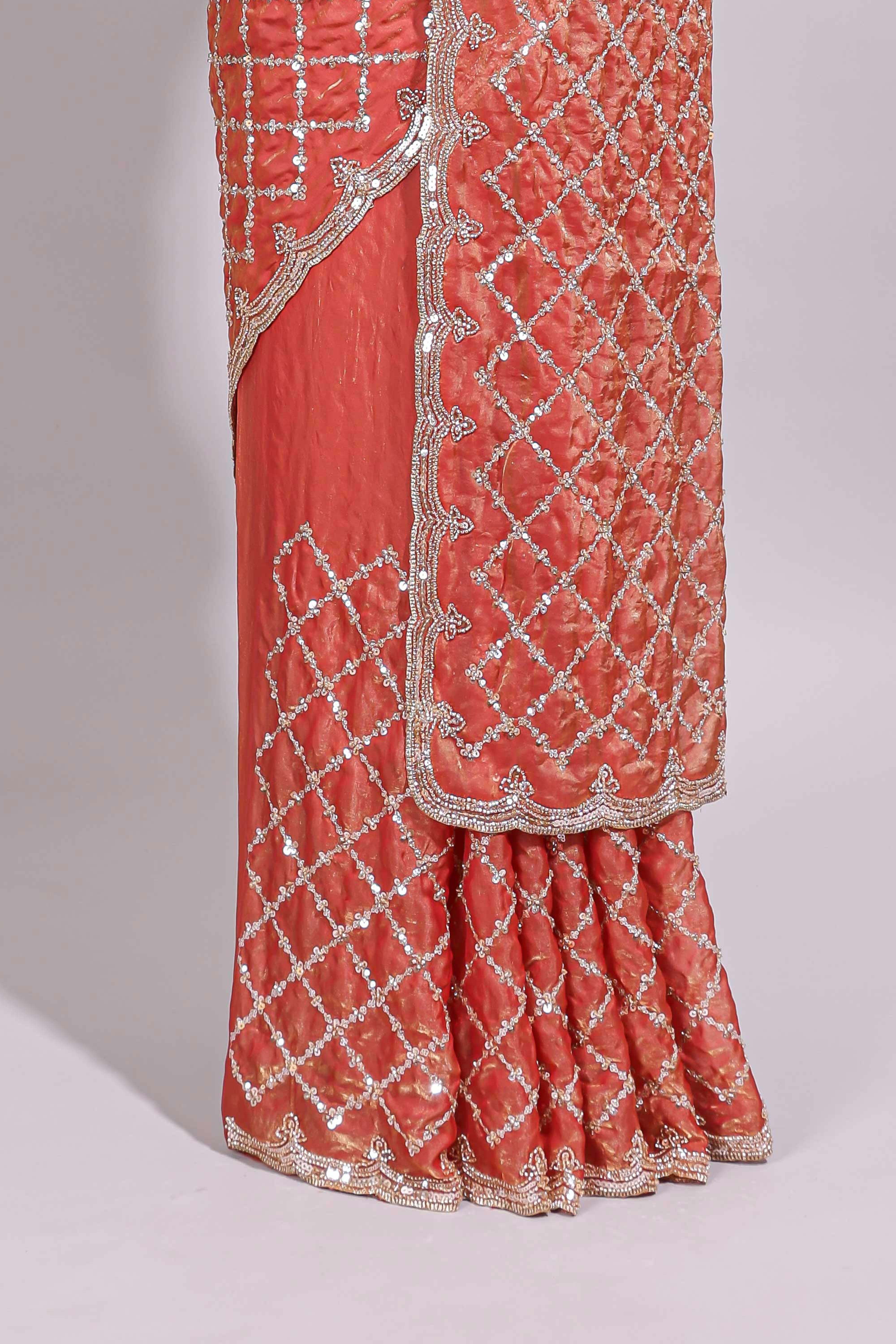 Coral pink saree with elegant silver sequin diamond embroidery featuring a shimmering border and pallu along with blouse